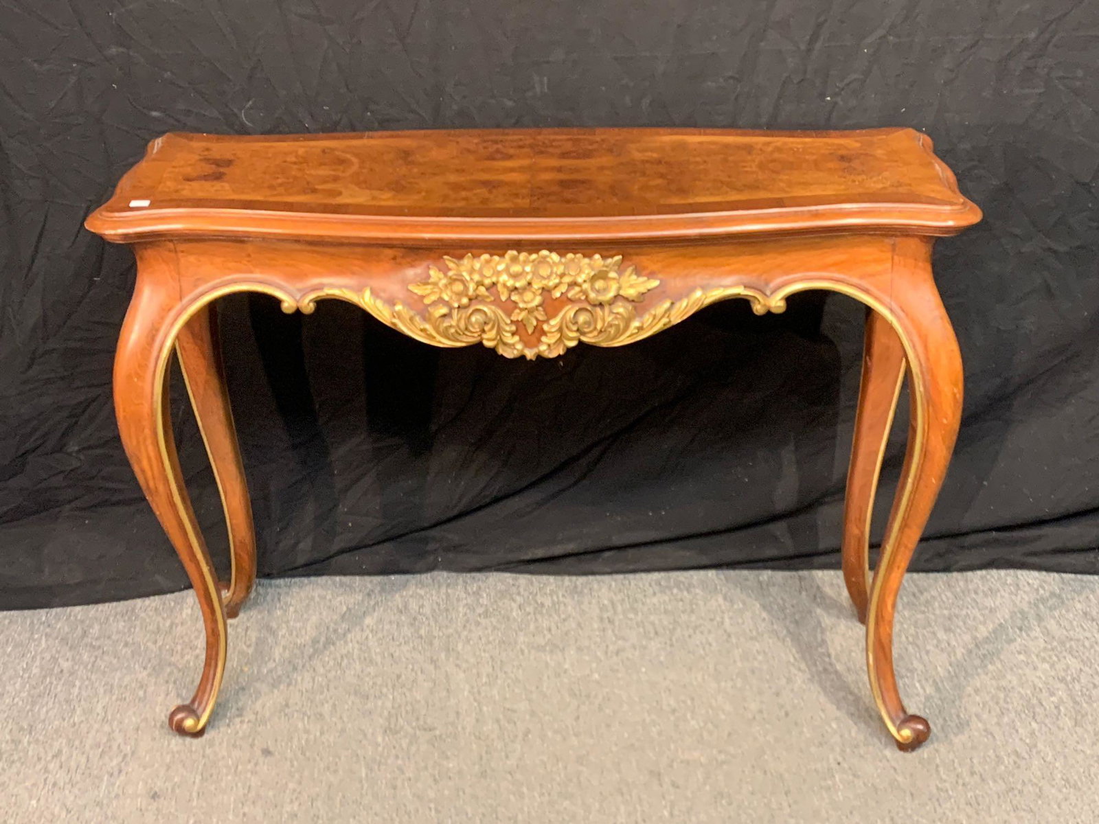 French Louis XV-style Carved Console: A French Louis XV-style carved and gilt painted console table on cabriole legs. Finished on both sides. 29in tall x 39in wide x 14in deep.