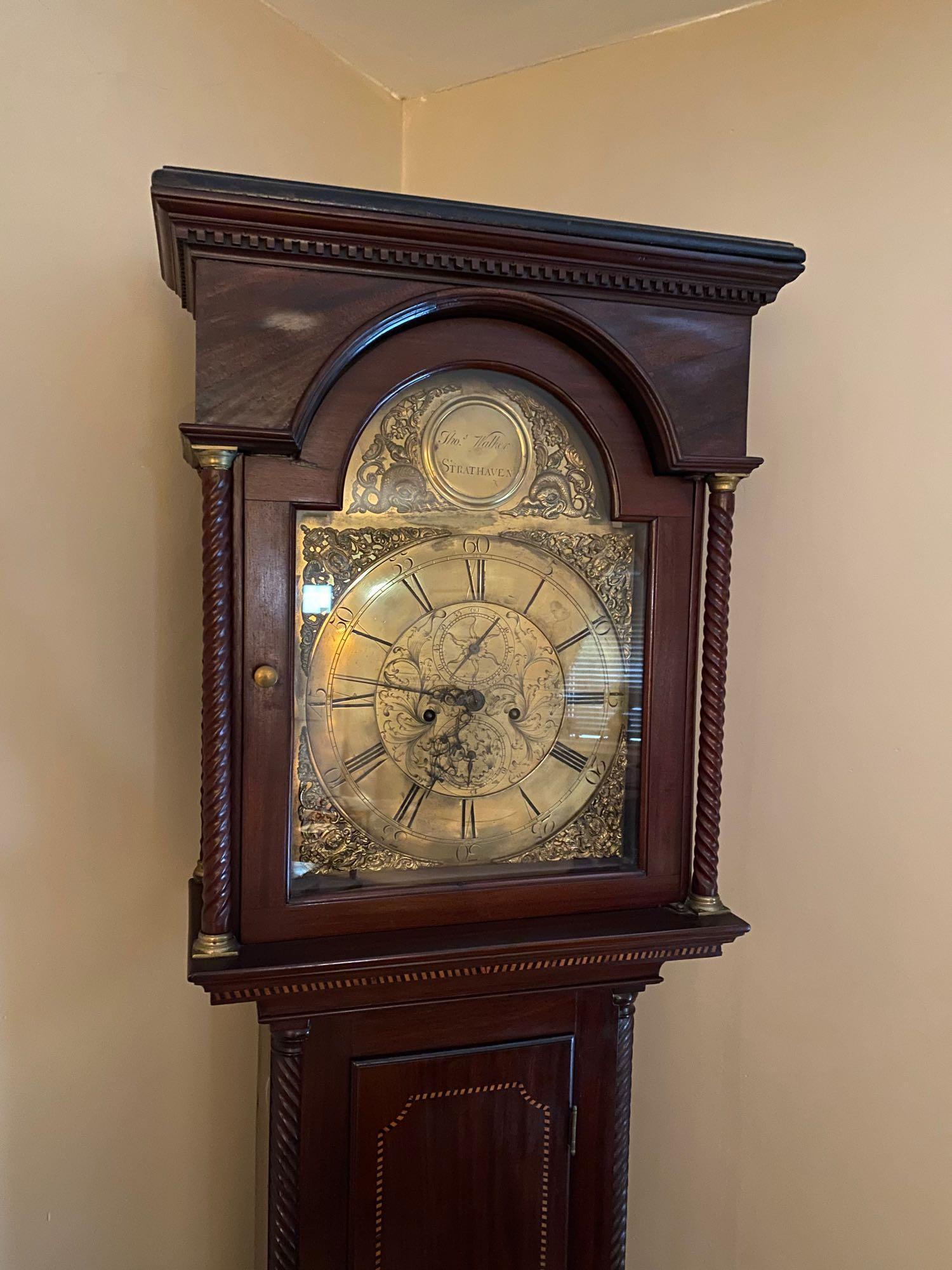 Georgian Tall Case Clock: A Georgian tall case clock by Thomas Walker, Strathaven, with a mahogany case and brass dial. 82 in tall x 22 in wide at bonnet x 14 in wide at the waist x 9-1/2 in deep.
