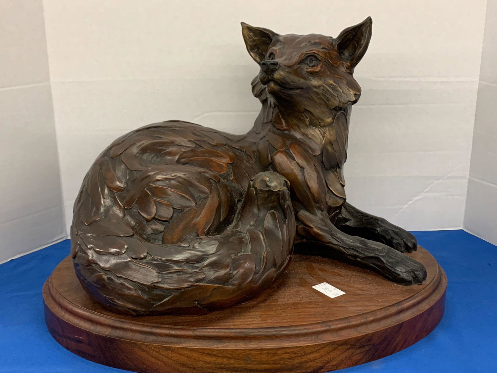Geoffrey Smith. Bronze, Red Fox Study: Geoffrey Smith (American, 20th Century). A bronze sculpture of a fox titled "Red Fox Study". Signed on back and numbered 21/98, sitting on an oval wooden base. With COA and paperwork. Overall dimensio