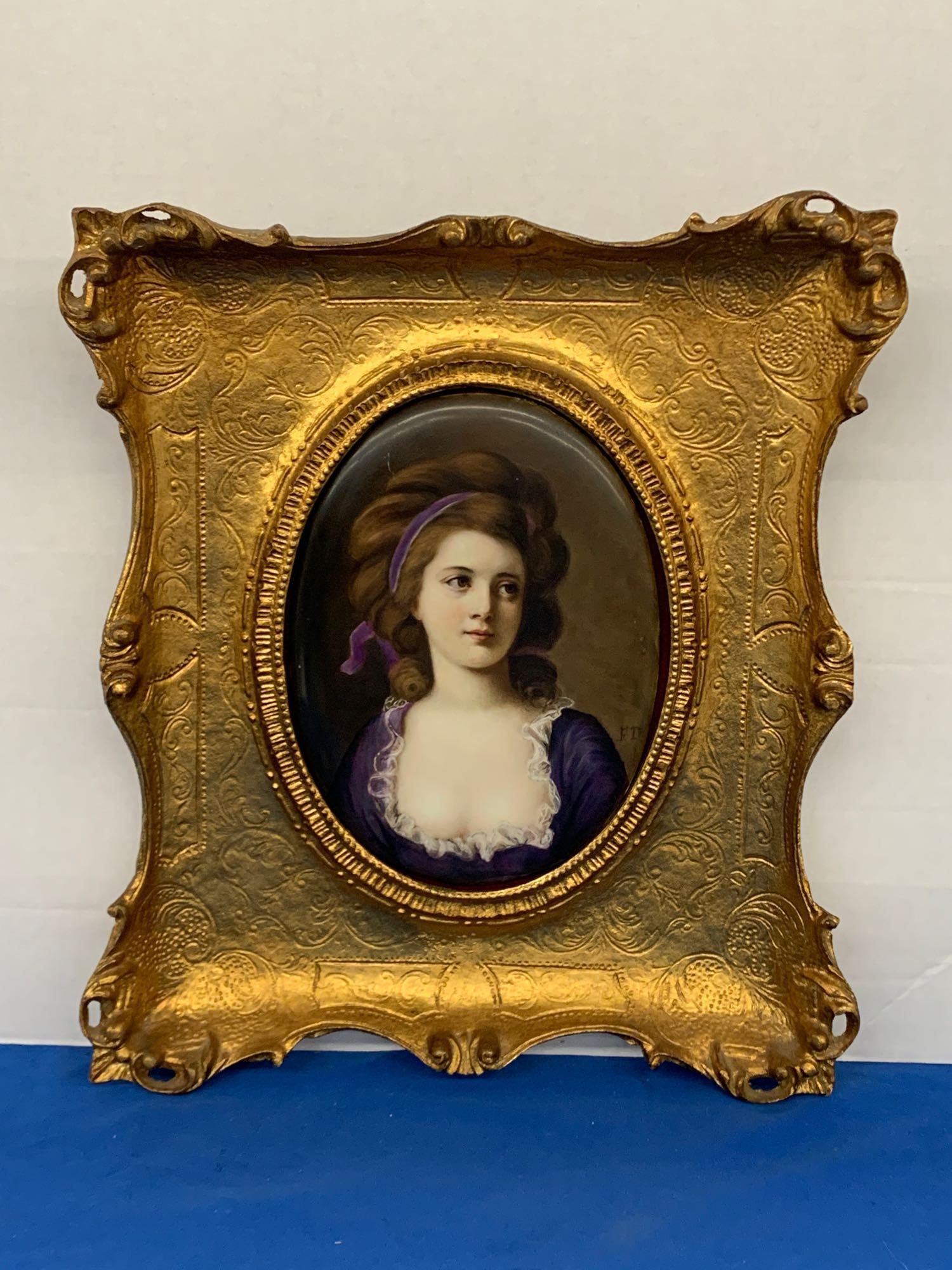 KPM Porcelain Portrait Plaque: A painted, oval KPM porcelain plaque depicting a portrait of a woman. Initialed F.T. middle right and marked verso. In a gilt frame. Plaque: 9in x 6-3/4in wide. Outside frame: 15-1/2in x 14in.