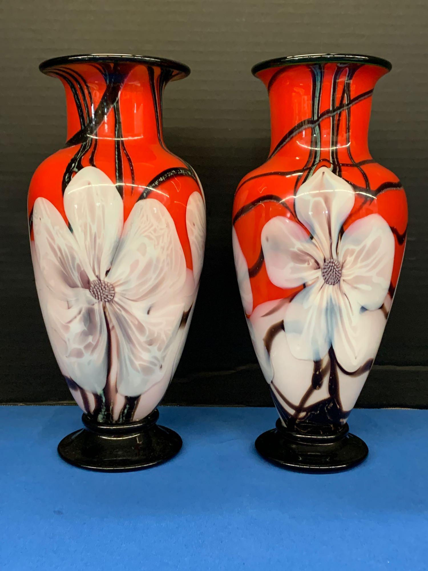 Pair of Orient & Flume Art Glass Vases: A pair of David Smallhouse for Orient & Flume art glass "Glossy Holiday Floral Vase" vases with floral design on red background with green interiors. Signed. 11-1/2in tall.