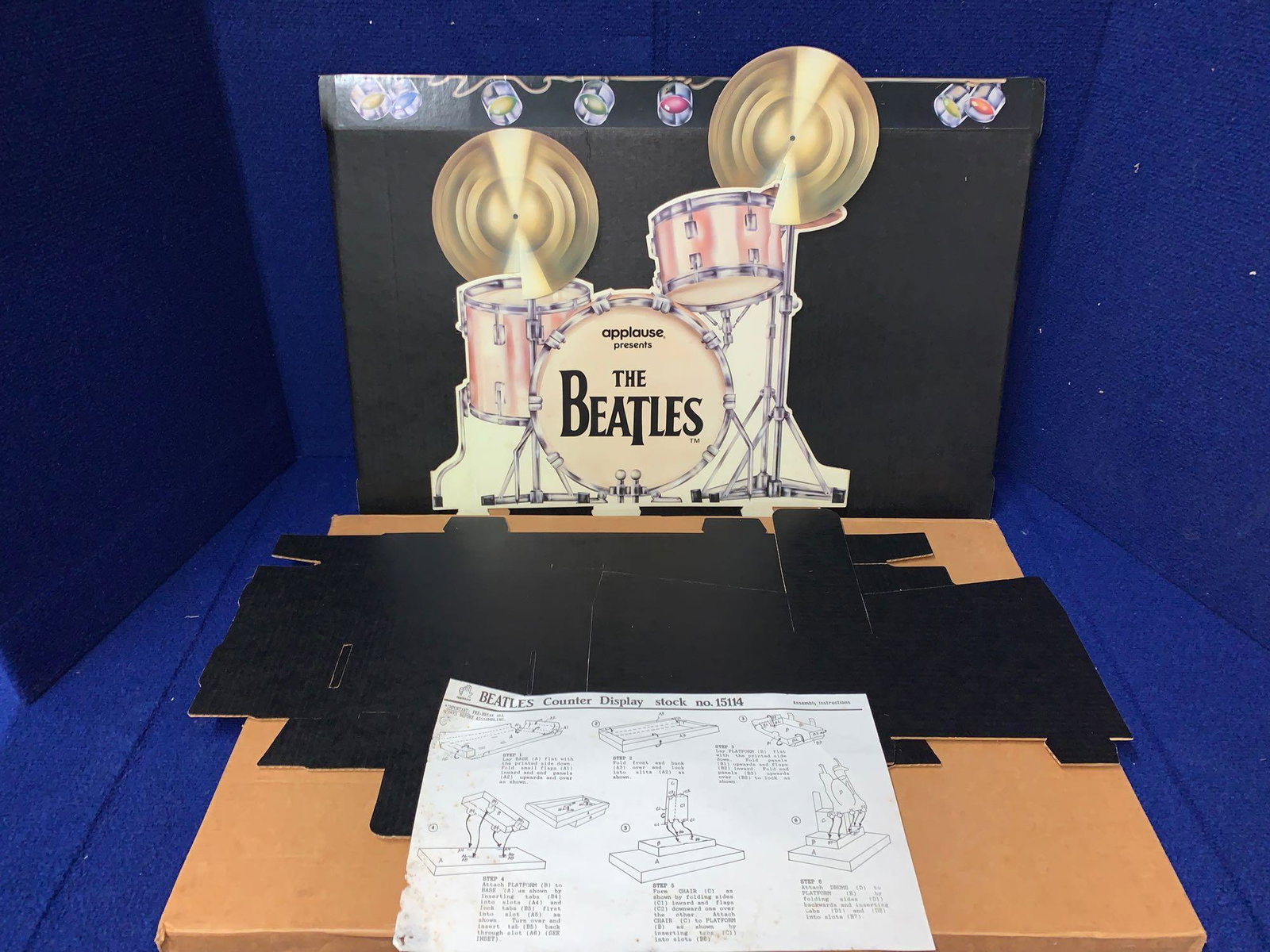 Applause Beatles Dolls & Promotional Display: A grouping of three Applause "Beatles Forever" figures: Paul, John and George. The boxes for John and George are still sealed. Paul's box is open, but Paul is still sealed in his original bag. All fou