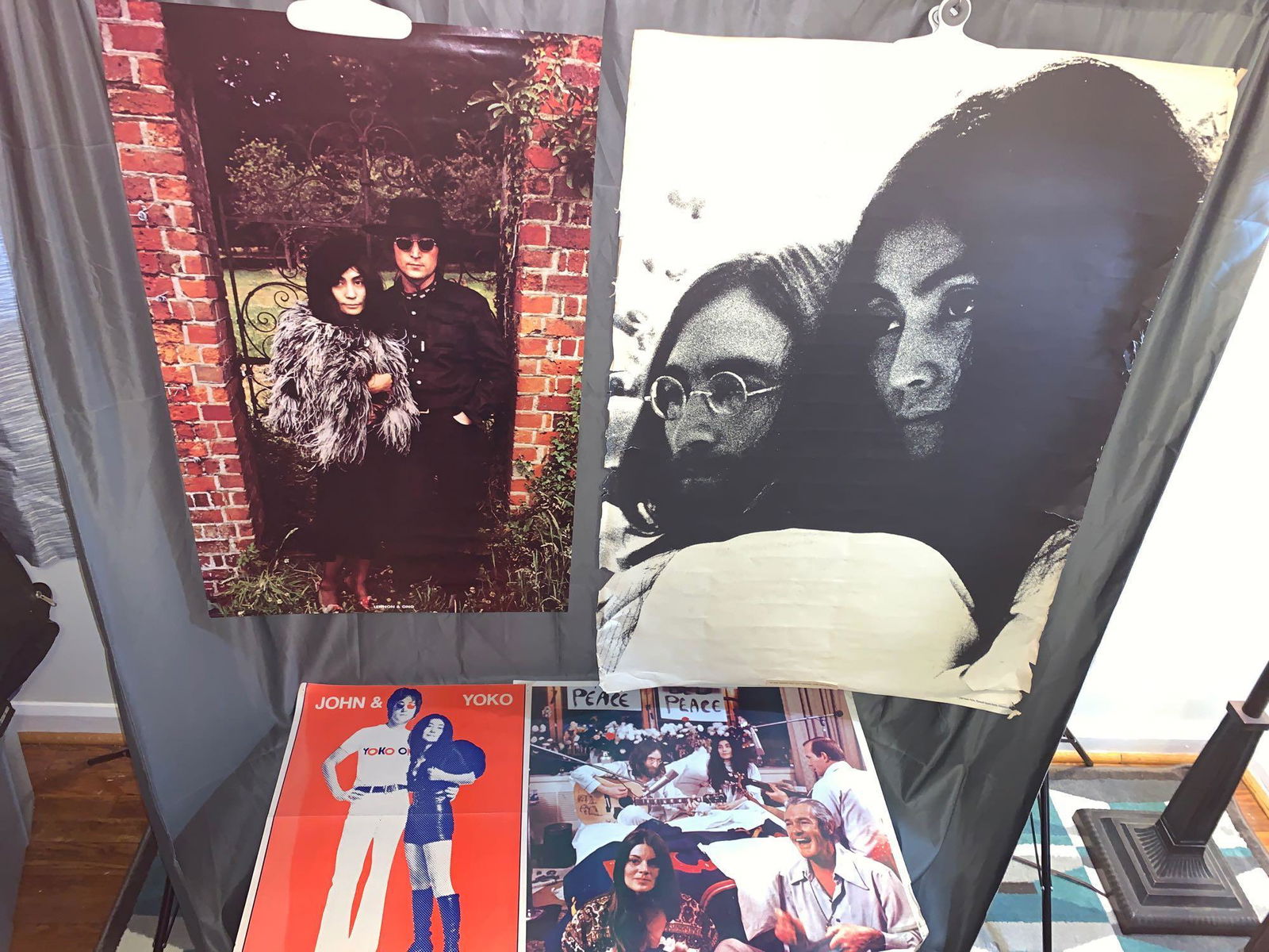 Four John Lennon & Yoko Ono Posters: Four John Lennon & Yoko Ono posters to include "Lennon & Ono" in front of an iron gate (35in x 22in, very good condition minor creasing); A large portrait poster of John & Yoko (42in x 30in, fair cond