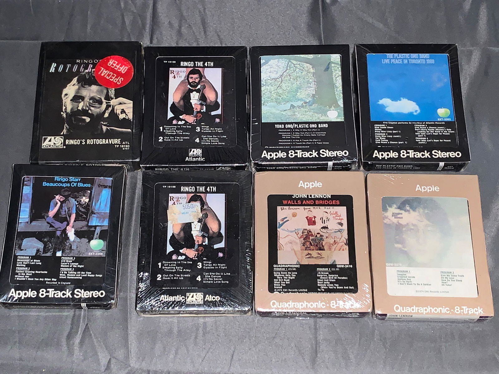 Eight Sealed John Lennon & Ringo Starr 8-Tracks: Eight sealed John Lennon and Ringo Starr 8-Track tapes, including Ringo Starr's "Rotogravure", "Beaucoup of Blues" and two "Ringo the 4th" tapes plus John Lennon's "Plastic Ono Band", "Walls and Bridg