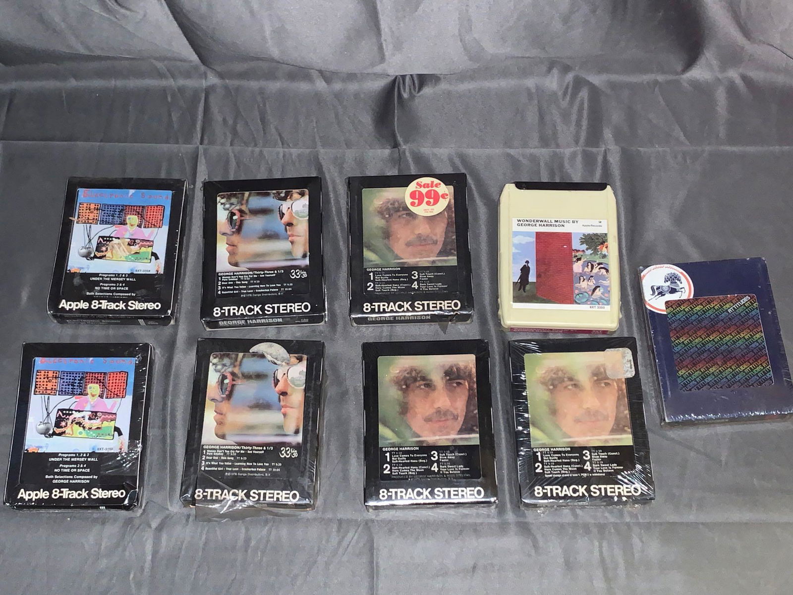 9 Unopened George Harrison & Attitudes 8-Tracks: A lot of nine unopened George Harrison and Attitudes 8-Track tapes including Attitudes self-titled tape on the Dark Horse label and George Harrison's "Wonderwall", two copies of "Electronic Sound", tw
