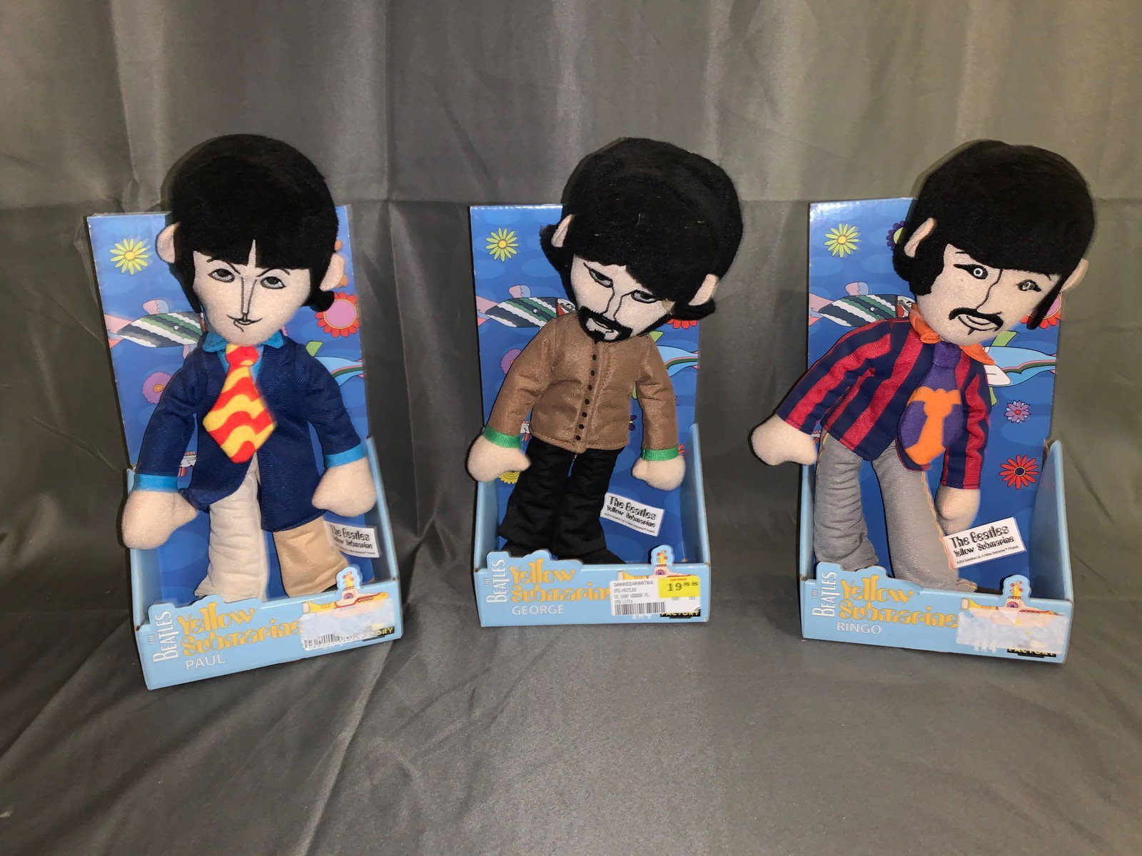 Three Beatles Yellow Submarine Plush Figures: A lot of three Beatles "Yellow Submarine" plush figures with original boxes. Each is approximately 11in tall.
