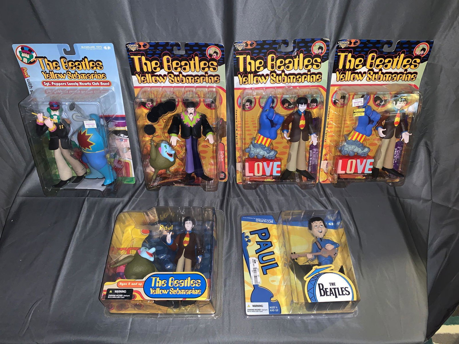 6 McFarlane Beatles Action Figures in Original: A group of six McFarlane Beatles action figures in original bubblepak. Tallest: 13.5in.