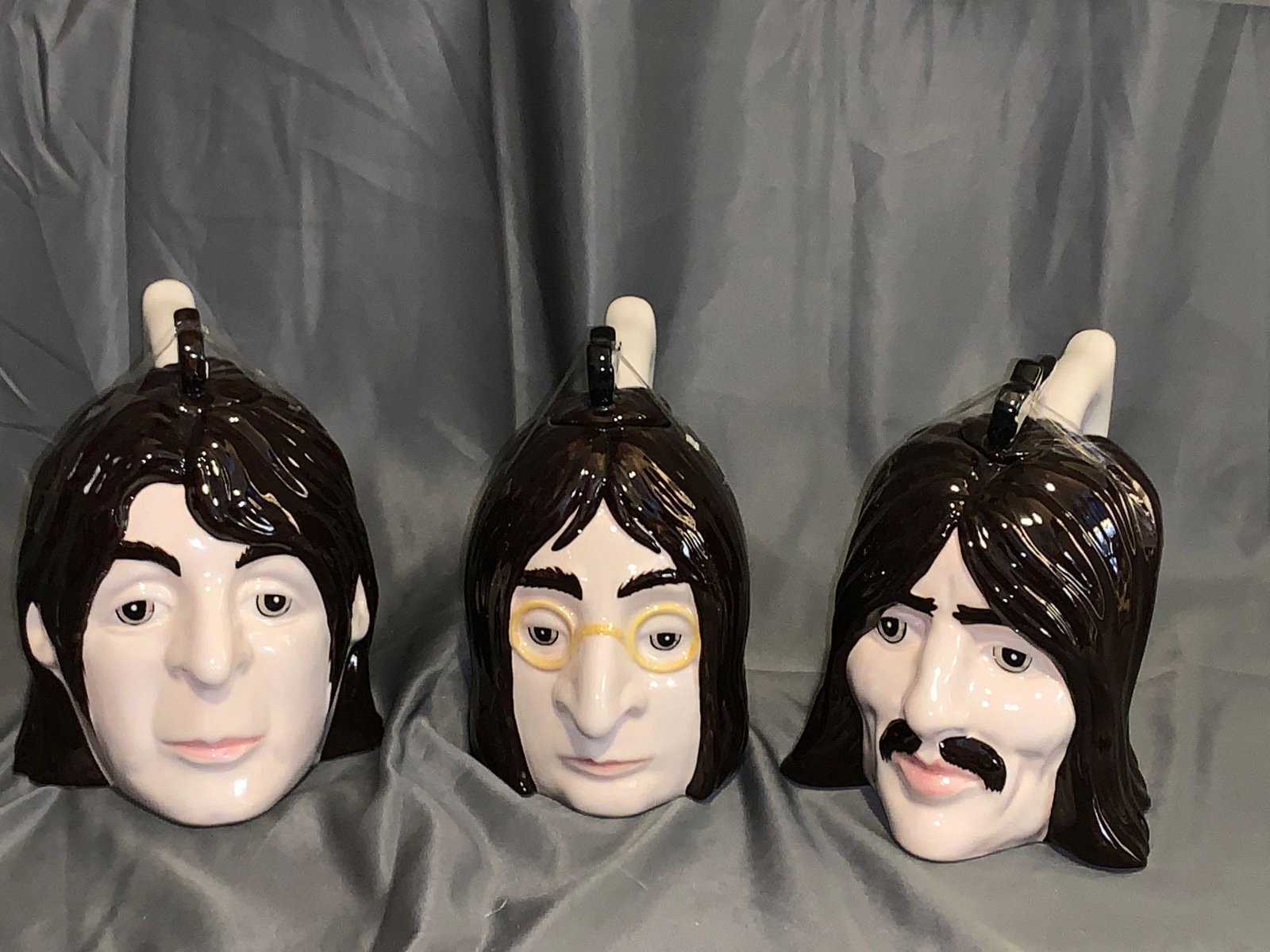 Set of Four Lorna Bailey Beatles Toby Mugs: A set of four Lorna Bailey Beatles Toby mugs with lids, apx. 7in tall x 8in nose to handle. Ringo is photographed separately.