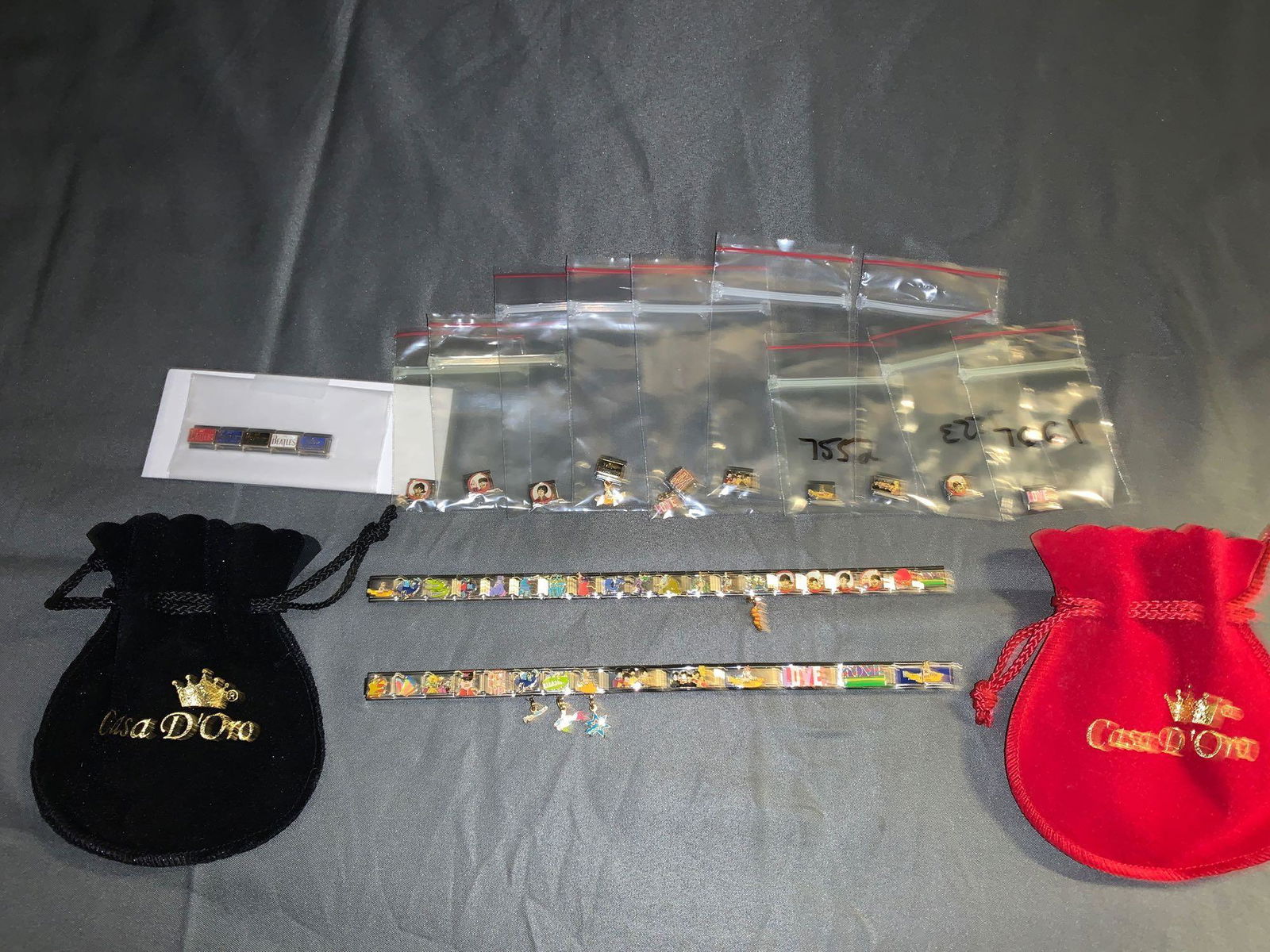 Two Beatles Casa D'oro Charm Bracelet and Charms: A lot of two Beatles Casa D'oro charm bracelets and charms.