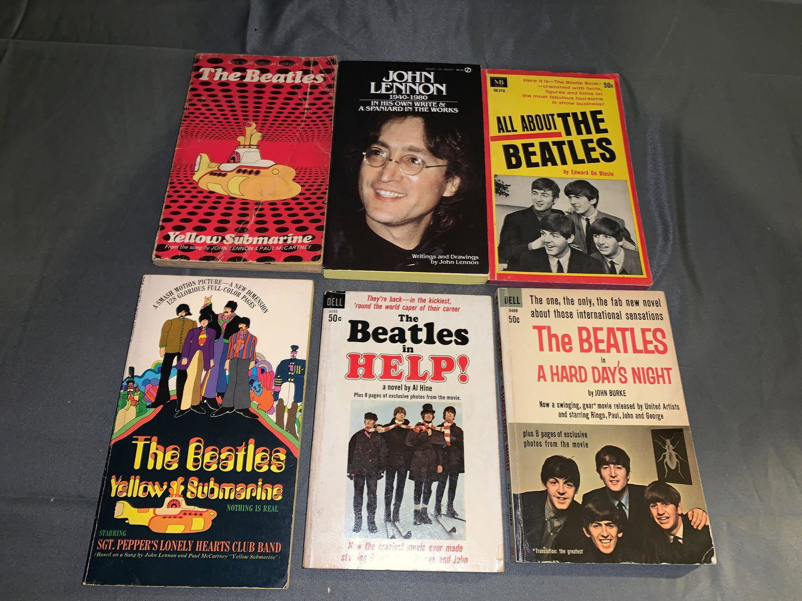 Six Vintage Beatles Paperback Books: A lot of six vintage Beatles paperback books, including a U.S. and British copy of "Yellow Submarine"; both are stated First Editions. "Help!" and "A Hard Day's Night" are both stated First Printings,