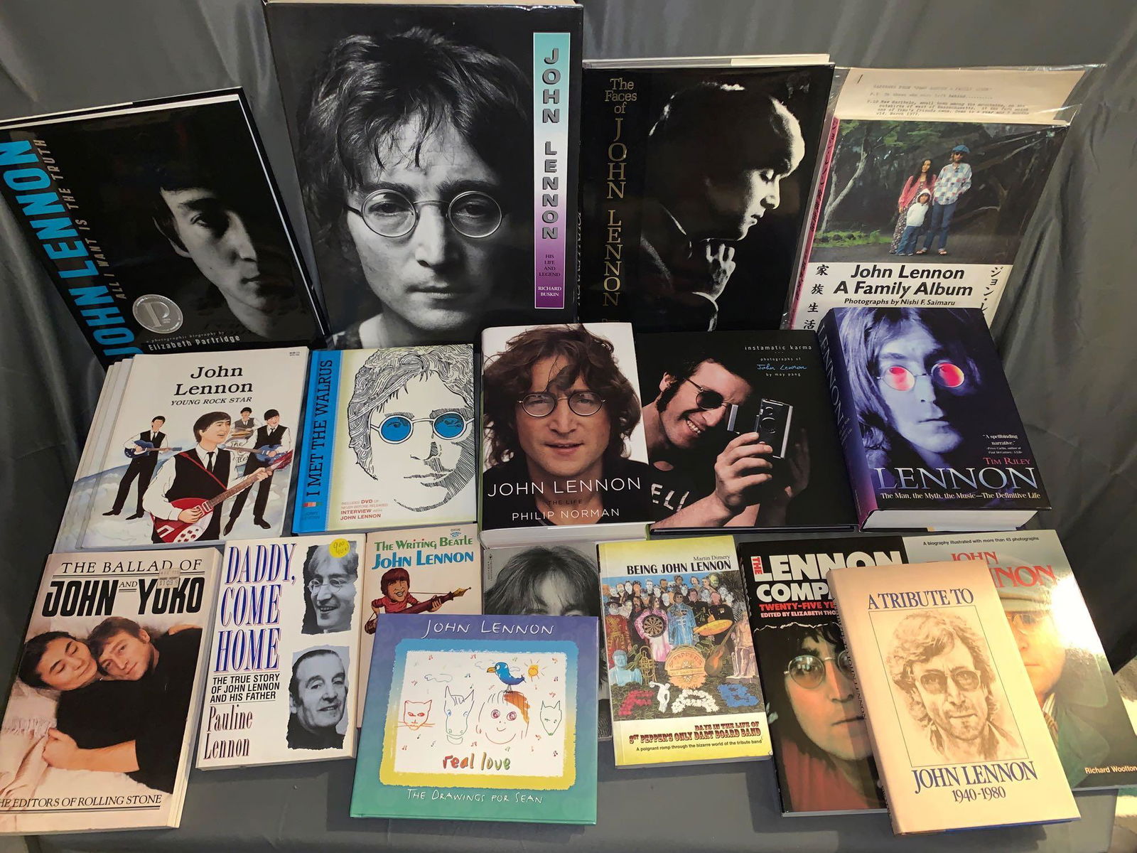 23 Books About John Lennon: A lot of 23 books about John Lennon, including mostly biographies and photo books. Two books by John Lennon include the Children's book "Real Love". There are a few stated First Editions including "Jo