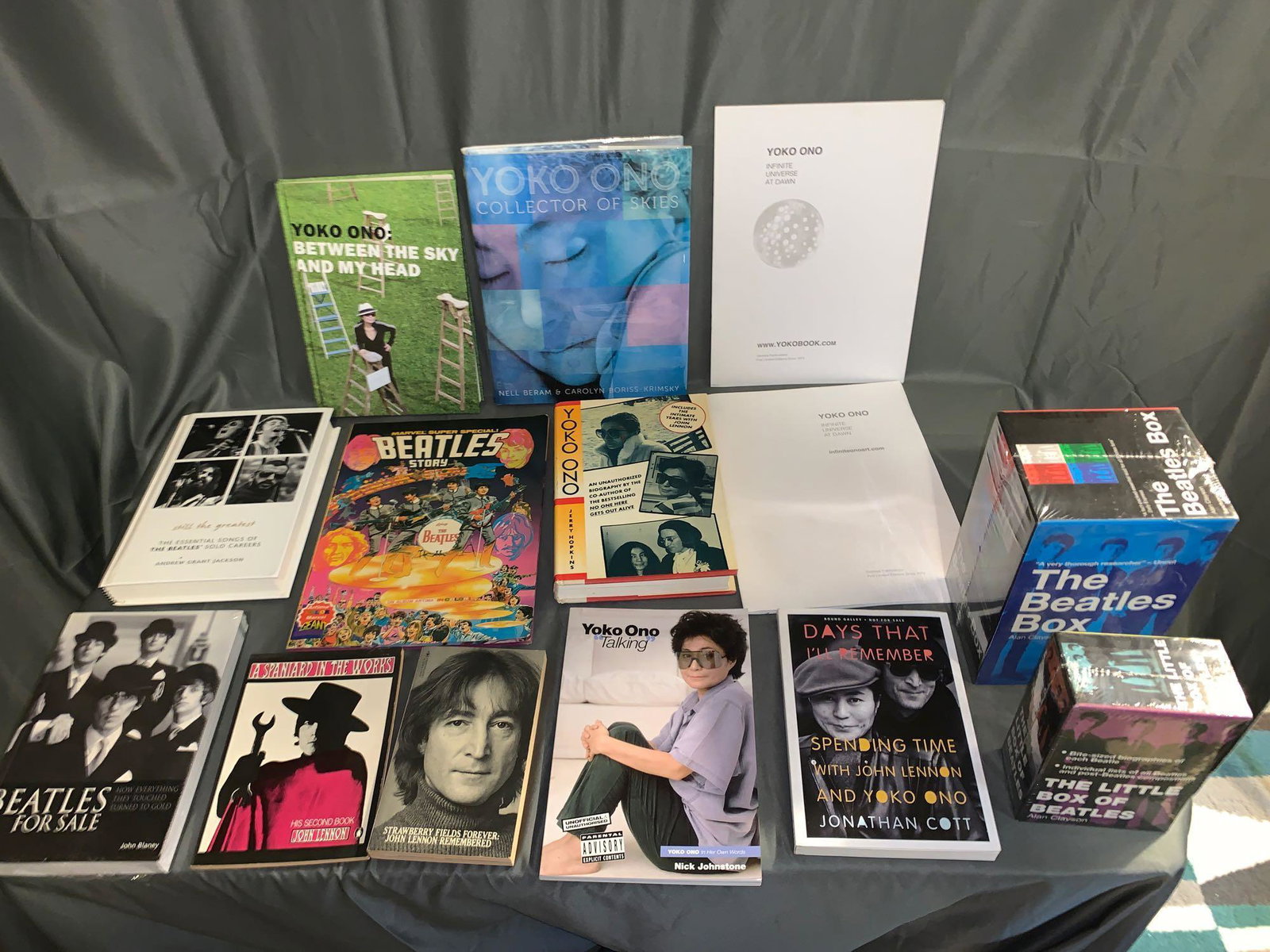 14 Beatles and Yoko Ono-related Books: A lot of 14 Beatles and Yoko Ono-related Books, including seven books relating to Yoko Ono, sealed copies of "Beatles For Sale", "The Beatles Box" and "The Little Box of Beatles", a Marvel comic book 