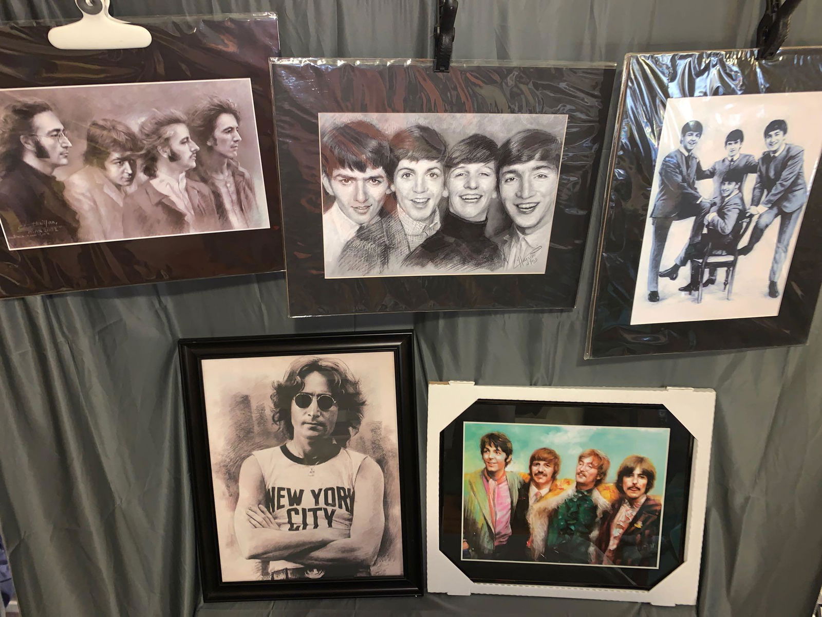 Five Beatles Prints: A lot of five Beatles prints including a framed John Lennon print and a framed color Beatles print by Haiyan (2005). Also there are three matted Beatles prints, one by Haruni (2003) and one by Haiyan