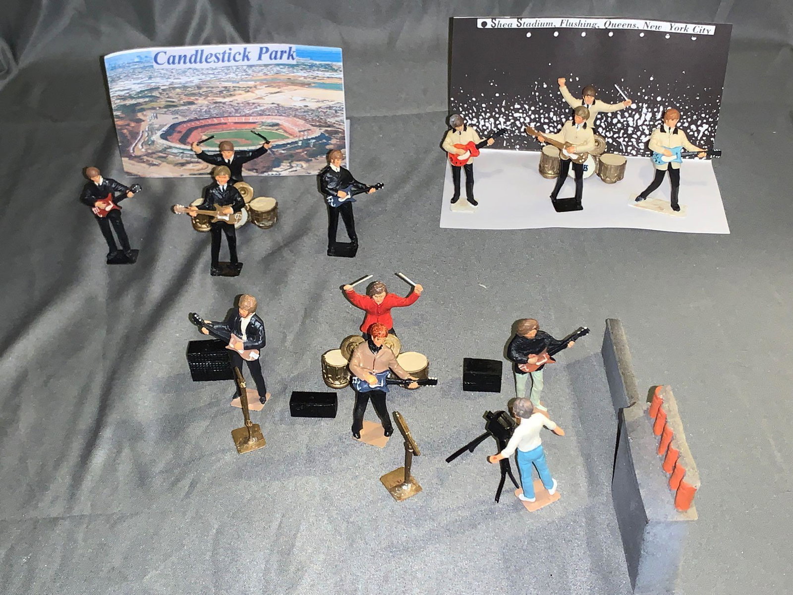 3 Sets of Little Lead Soldiers Beatles Concerts: A lot of three sets of Little Lead Soldiers Beatles Concerts including the concerts at Shea Stadium and Candlestick Park in 1966, and their Rooftop Concert in 1969. Each metal figure is about 2.5in ta