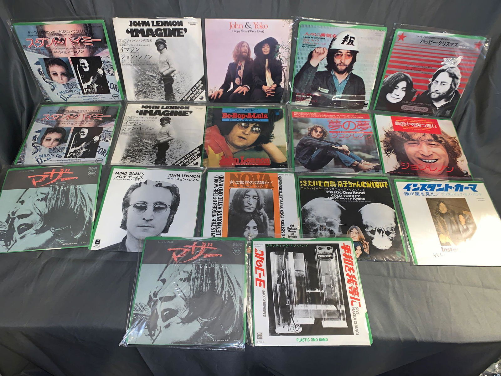 17 John Lennon Non-U.S. 45rpm Records: A lot of 17 John Lennon non-U.S. 45rpm records with picture sleeves, 16 of which are Japanese pressings, the other was pressed in Argentina.