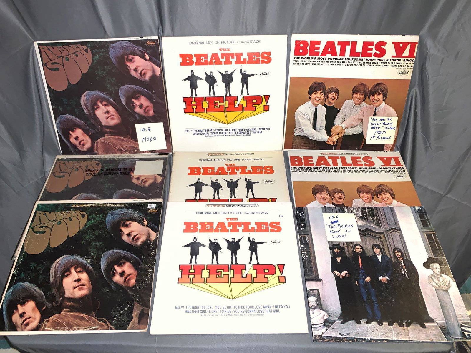 Nine Beatles 33rpm Records: A lot of nine Beatles 33rpm records including two "Beatles VI" one mono and one stereo, both grade (VG+/VG), "Hey Jude" on Apple, label shows "The Beatles Again" (VG+/VG+), three copies of "Help!" one