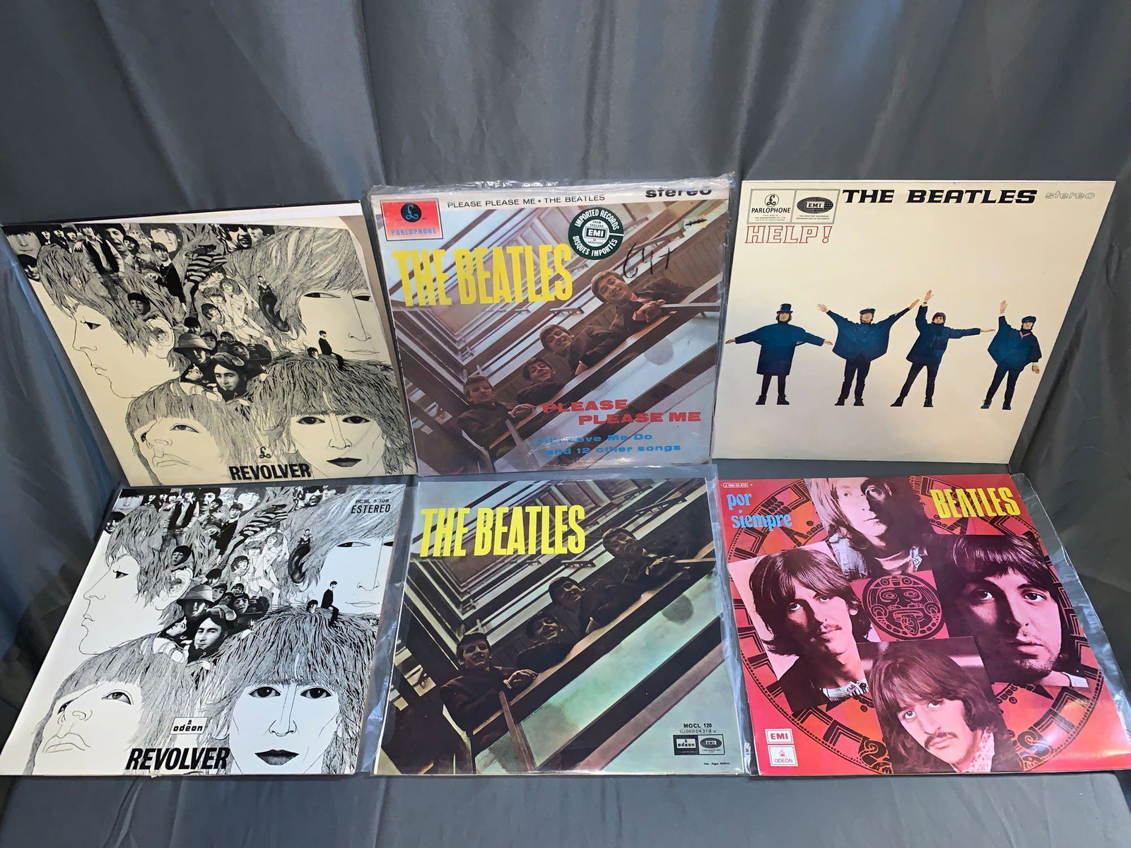 Six Beatles 33rpm Records: Spain & U.K.: A lot of six Beatles 33rpm records from Spain and the U.K., including from Spain "Revolver" (VG+/VG+), "The Beatles" (VG+/NM) and "Por Siempre" (VG+/VG+) and from the U.K. "Revolver" (VG/VG+), "Please