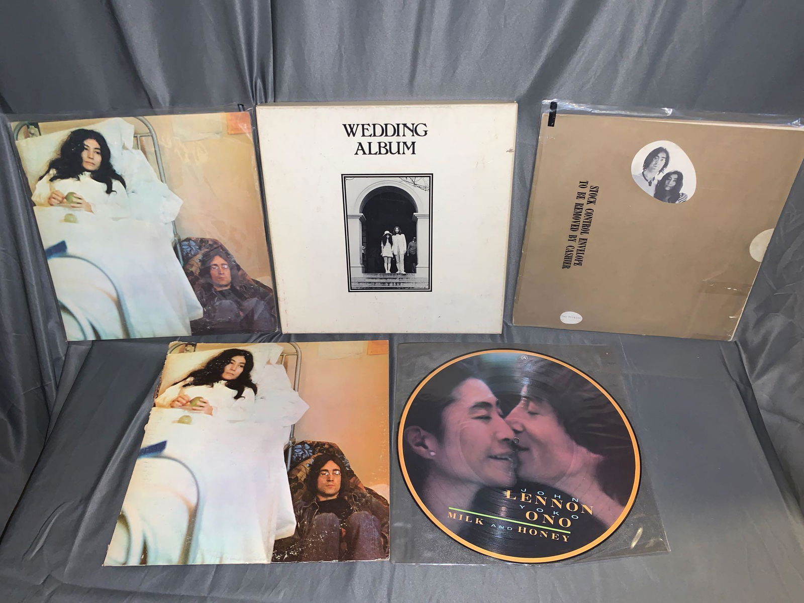 Five John Lennon/Yoko Ono 33rpm Records: A lot of five John Lennon/Yoko Ono 33rpm records, including "Wedding Album" (VG/VG many inserts, not sure if all are there), "Two Virgins" (VG+/VG+), "Milk and Honey" (picture disc VG+) and two copies