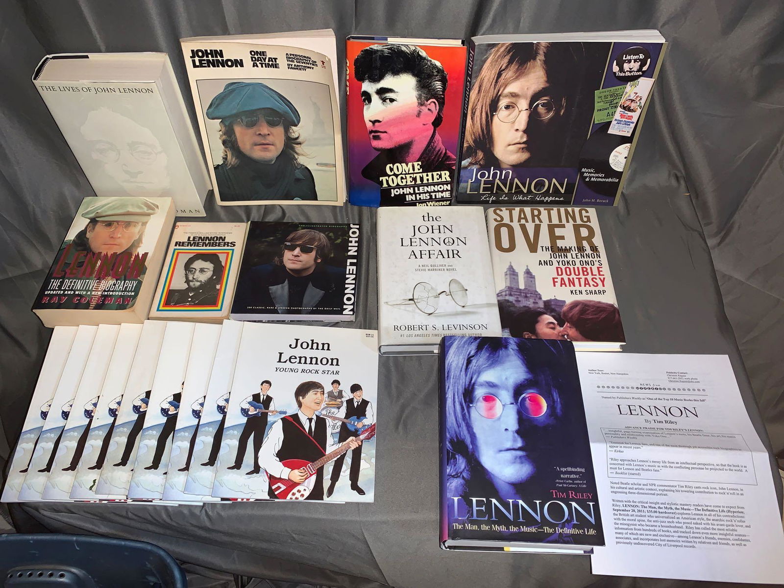 19 Books About John Lennon: A lot of 19 Books about John Lennon, including nine "John Lennon Young Rock Star" children's books, Tim Riley's "Lennon" with press release, a book on John Lennon memorabilia, and more.
