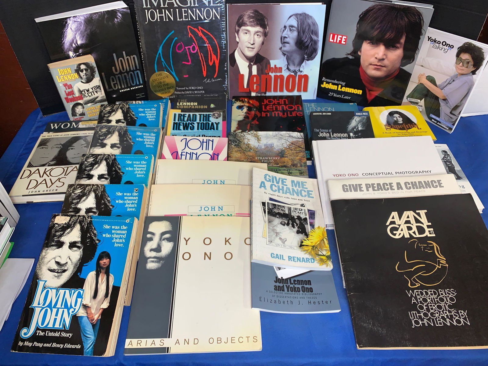 31 Books About John Lennon and Yoko Ono: A lot of 31 books about John Lennon and Yoko Ono, including first editions of "Arias and Objects", "John Lennon Summer of 1980", "Dakota Days" and "Woman". Also included are copies of "Grapefruit" and