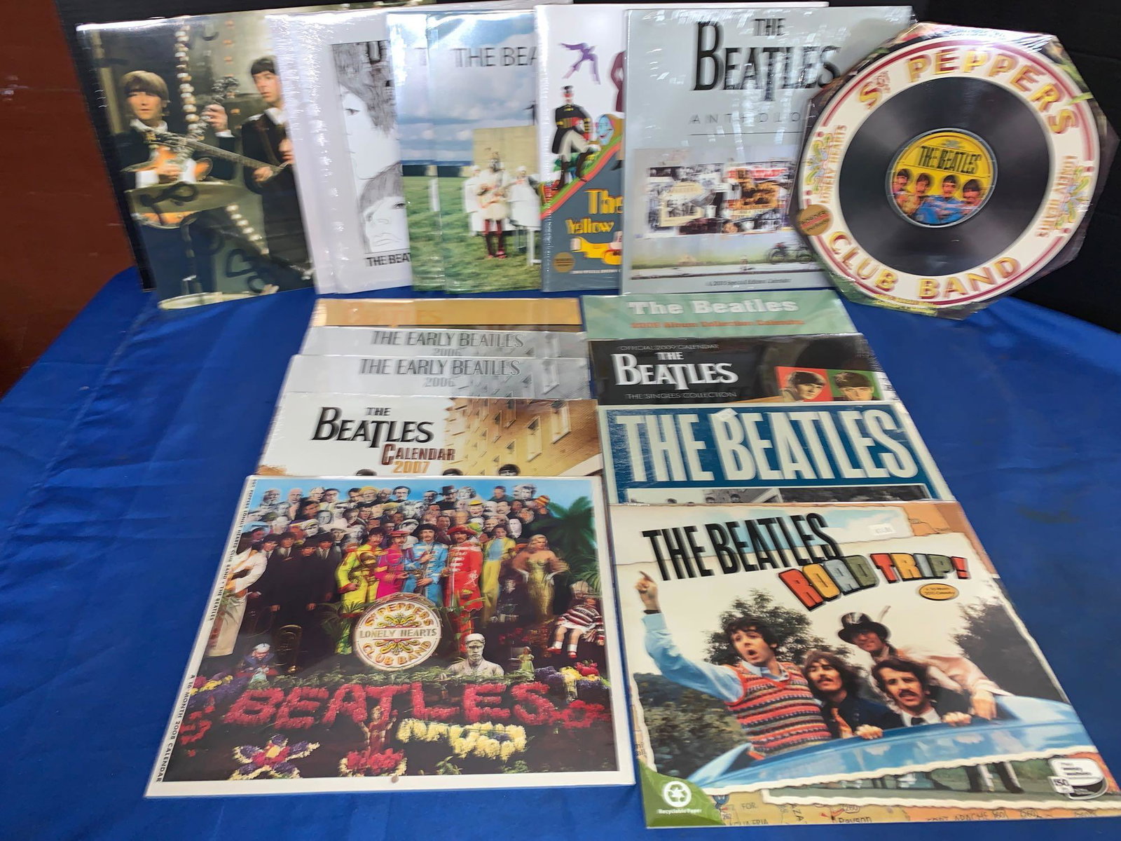 17 Unopened Beatles Calendars: A lot of 17 unopened Beatles calendars, including some special or collector editions. Part of this grouping includes Sgt. Peppers, Yellow Submarine and Beatles Anthology Special Edition calendars.