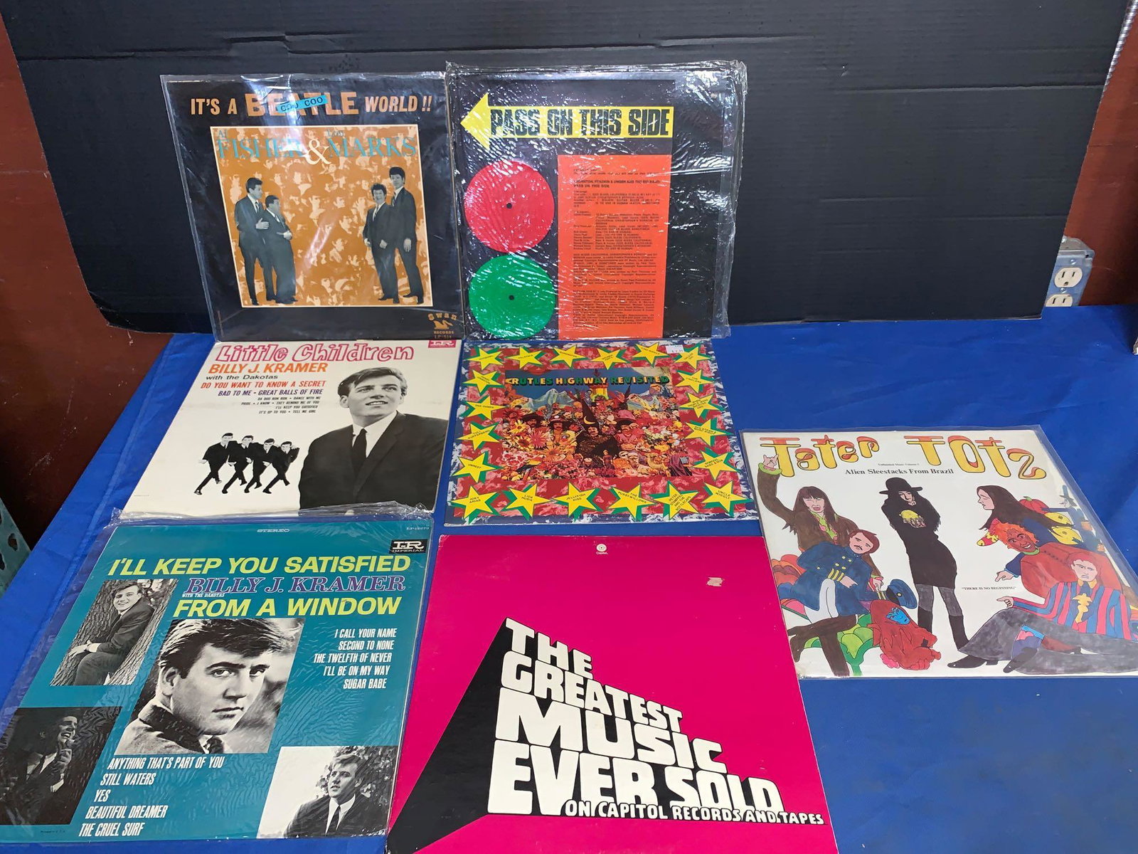 Seven Beatles-related Albums: A lot of seven Beatles-related albums including "Pass on This Side" an ESP label record on which Paul and Linda McCartney make a cameo, and a Capitol label promotional album that features 3 Beatles, 1