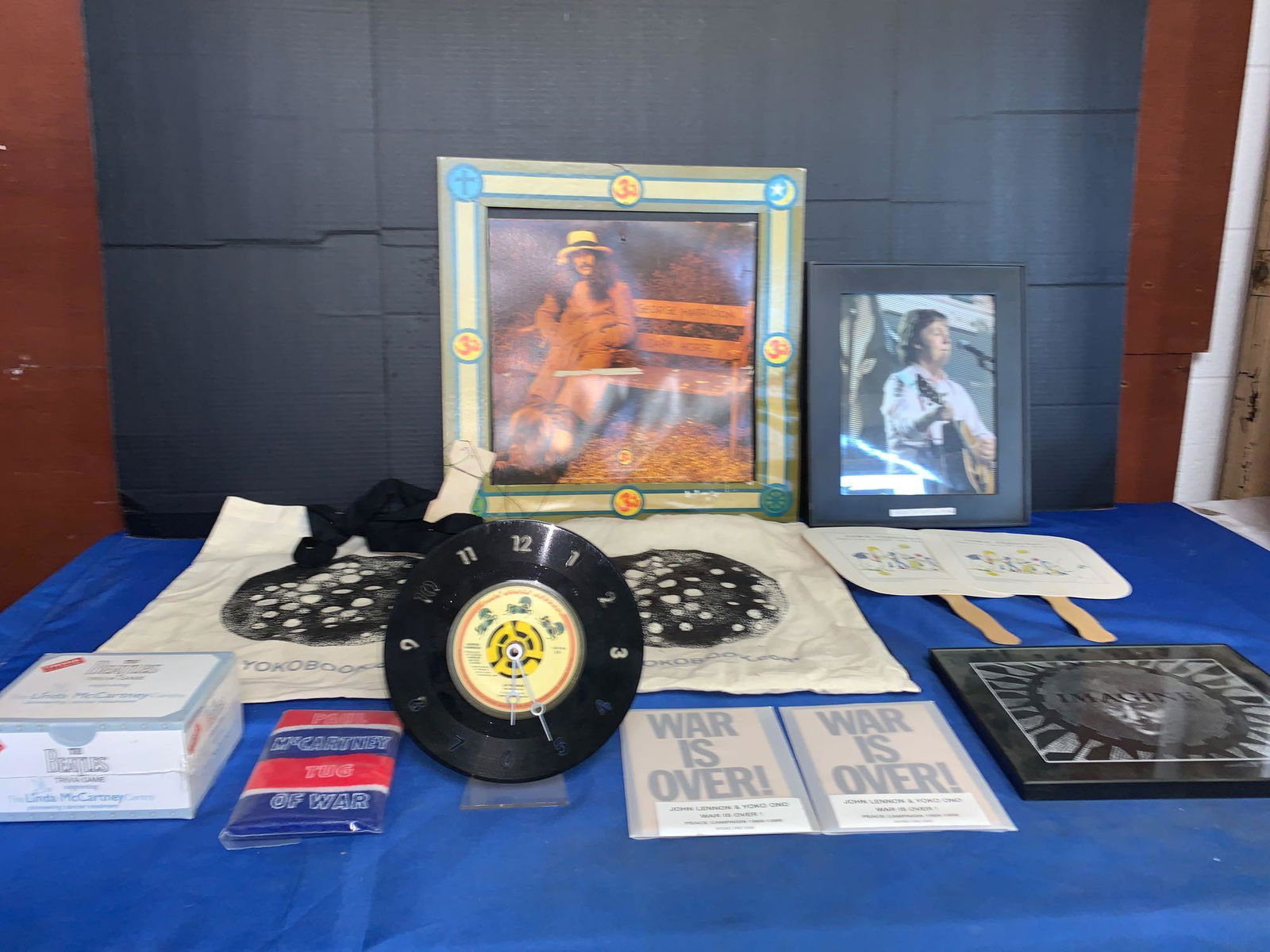 Solo Beatles & Yoko Ono Grouping: A grouping of solo Beatles and Yoko Ono memorabilia including two Yokobook tote bags, two sets of "War Is Over Peace Campaign" postcards (never opened), two promotional hand fans with a John Lennon il