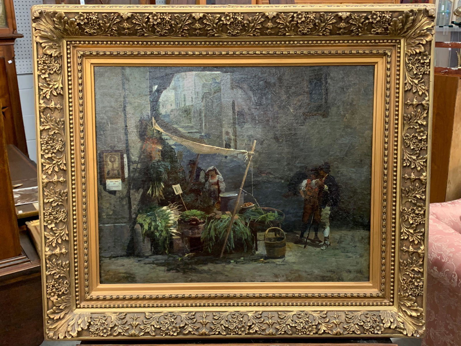 Continental School Oil on Canvas, Market Scene: A 19th C. oil on canvas depicting an outdoor market scene. Signed illegibly lower left. In a gilt foliate frame. Newman Galleries label verso. Stretcher: 24-1/2in x 20in. Outside frame: 29in x 34in.