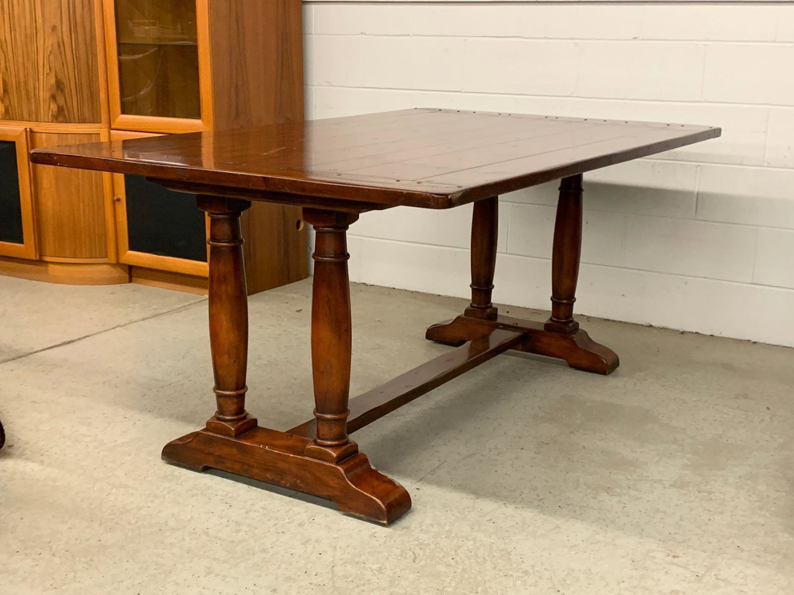 Cherry-finish Farmhouse-style Dining Table: A contemporary farmhouse-style dining table. 30in tall x 72in wide x 42in deep.