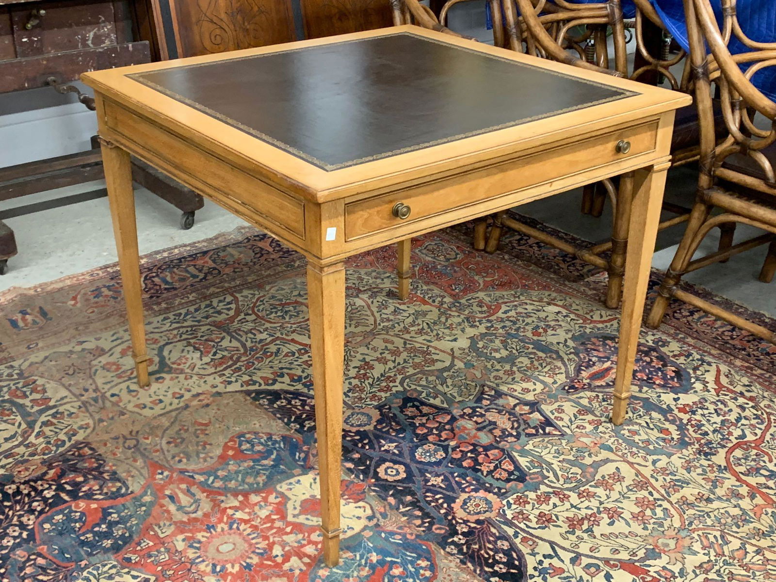 Kittinger Leather-Top Game Table: A Kittinger, Buffalo, game table having a square, tooled-leather top and single drawer. 29 in tall x 34 in wide x 34 in deep.