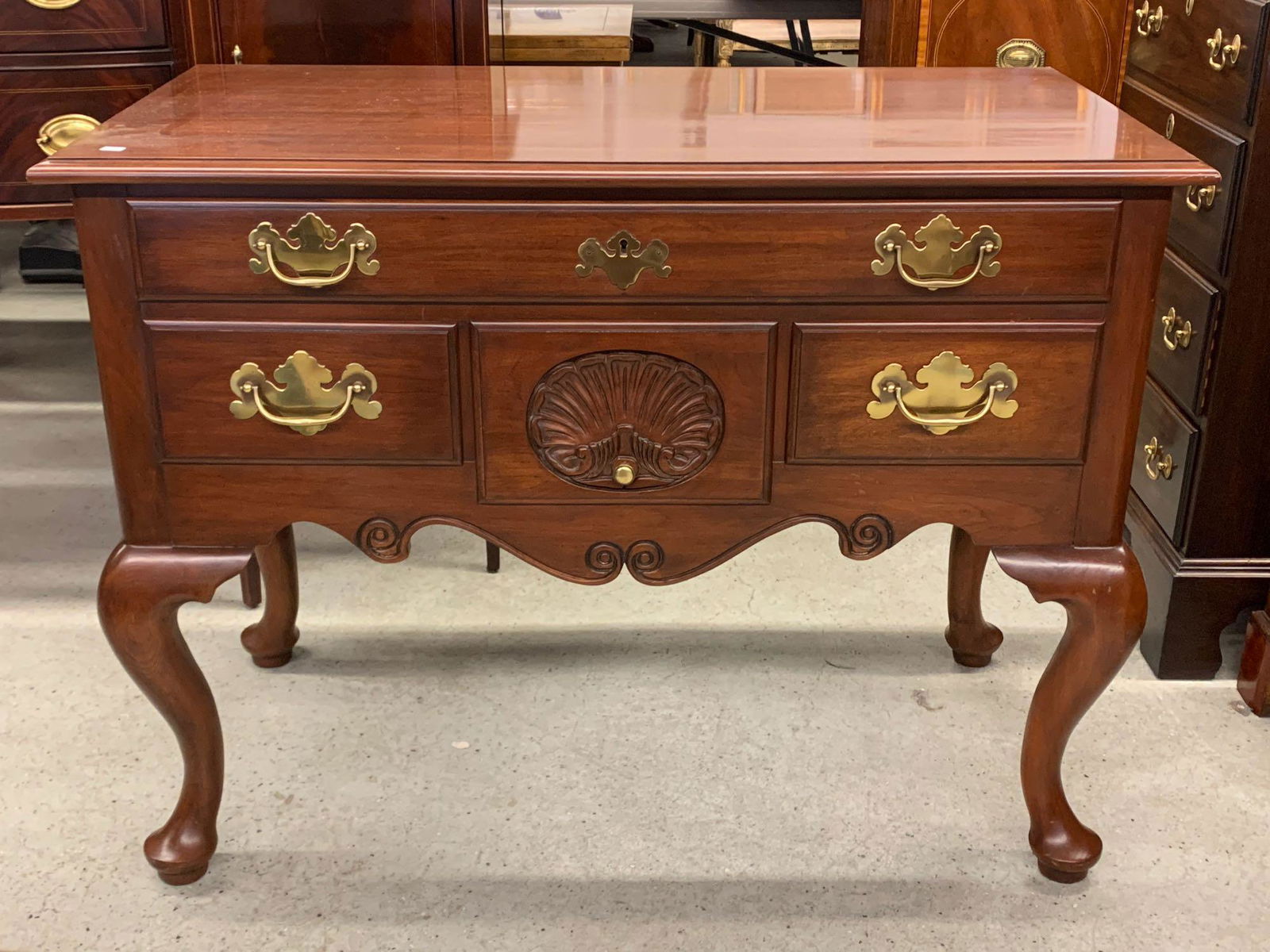 Henkel Harris Philadelphia Lowboy: A Henkel Harris, Virginia Galleries cherry Queen Anne-style Philadelphia lowboy. 31in tall x 41in wide x 21in deep.