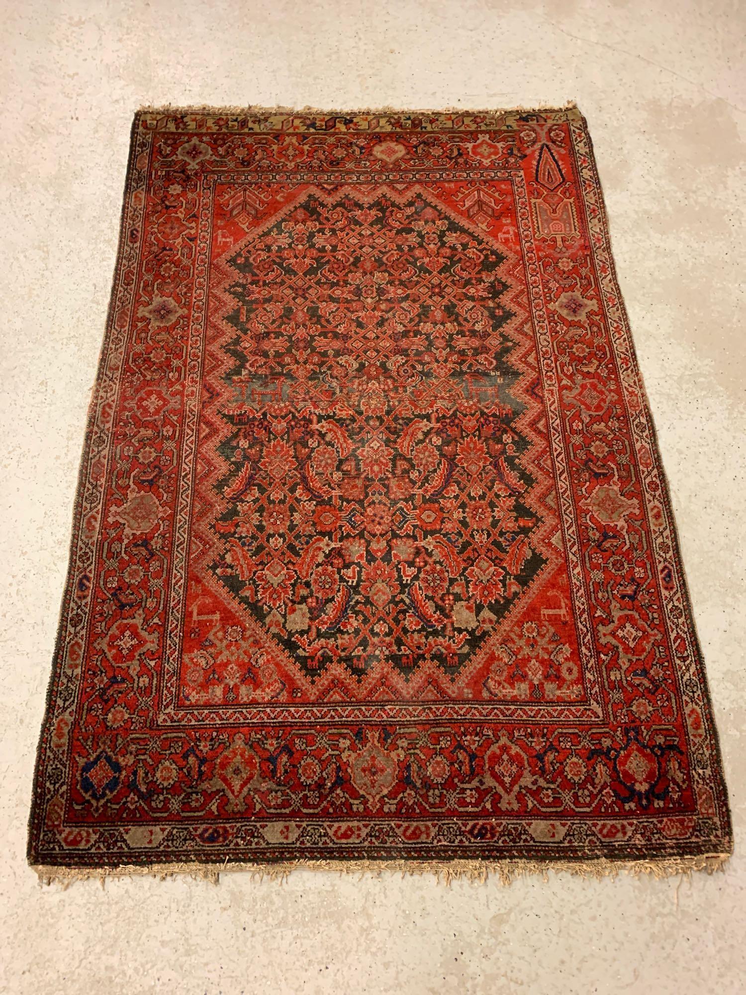 Antique Persian Malayer Carpet, 6ft 10in x 4ft 6in: An antique Persian area carpet with geometric and animal design on a red background. 6ft 10in x 4ft 6in.