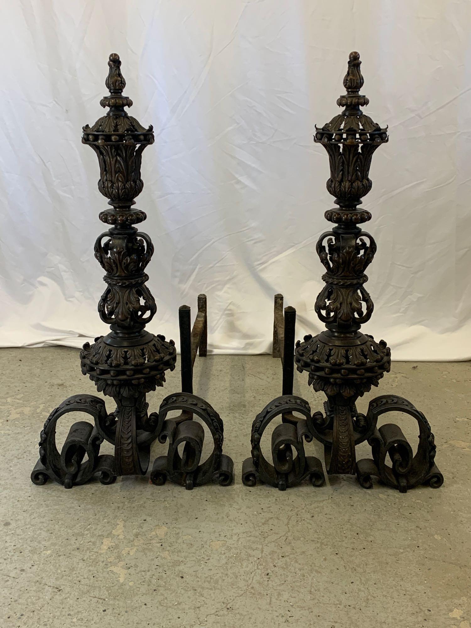Pair of Monumental Henry Burden Baroque Andirons: A monumental pair of bronze and hand-wrought iron baroque-style andirons, late 19th/early 20th C., attributed to Henry Burden, New York. Stamped Burden along scrolled feet. Each is 34 in tall x 17 in 