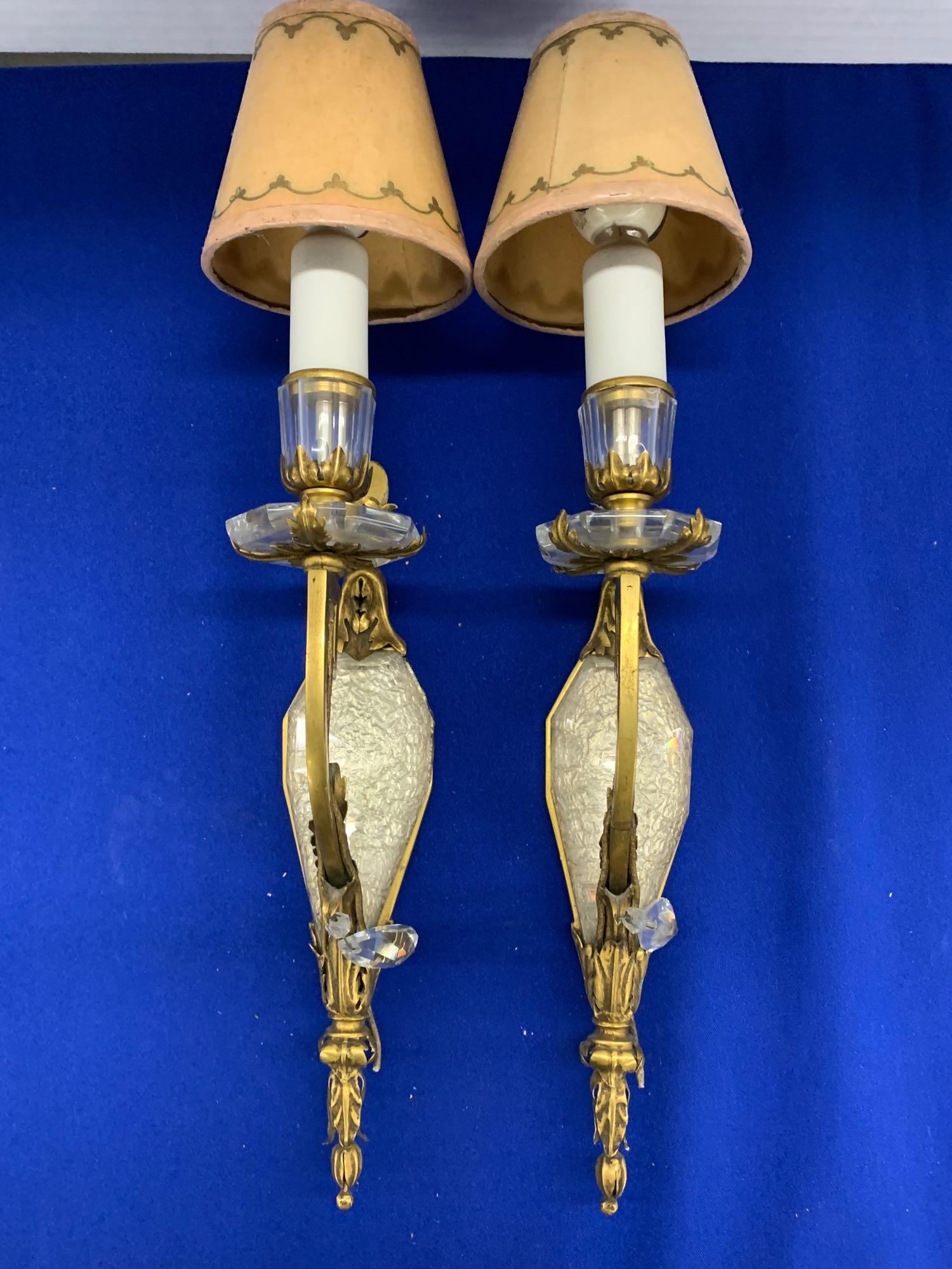 Pr. Bagues-style Gilt Metal and Crystal Sconces: A pair of wall sconces in the style of Maison Bagues, having gilt metal arms and crystal mounts. Height: 16in to top of shades.