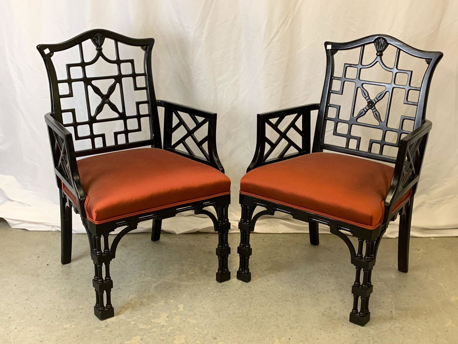 Pair of Chinese Chippendale-style Armchairs: A pair of Century Furniture Chinese Chippendale-style armchairs with ebonzied frames. Each chair: 39 in tall x 25-1/4 in wide x 20 in deep.