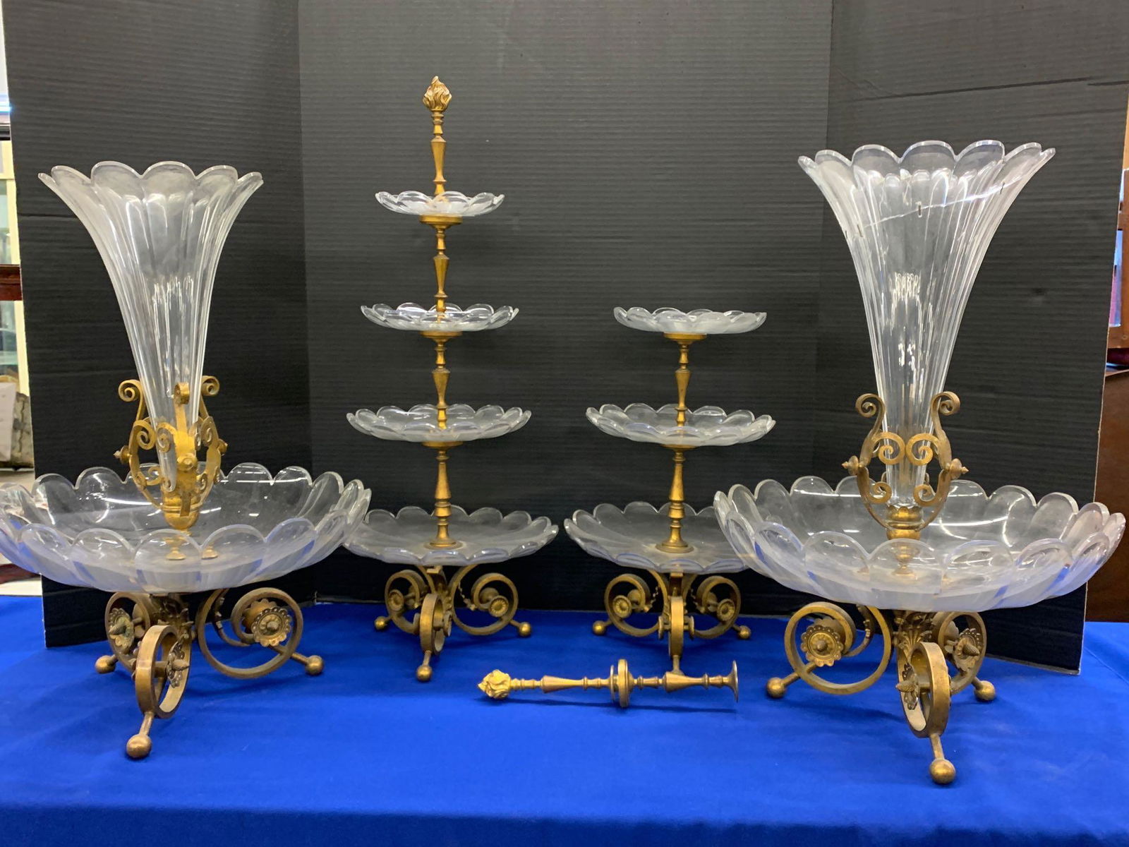 A Louis XV Style Centerpiece Suite: A four-piece Louis XV style gilt bronze and glass centerpiece suite consisting of a pair of epergnes and two pastry stands. Pastry stands: 24-1/2 in tall. Provenance: From an important Main Line estat