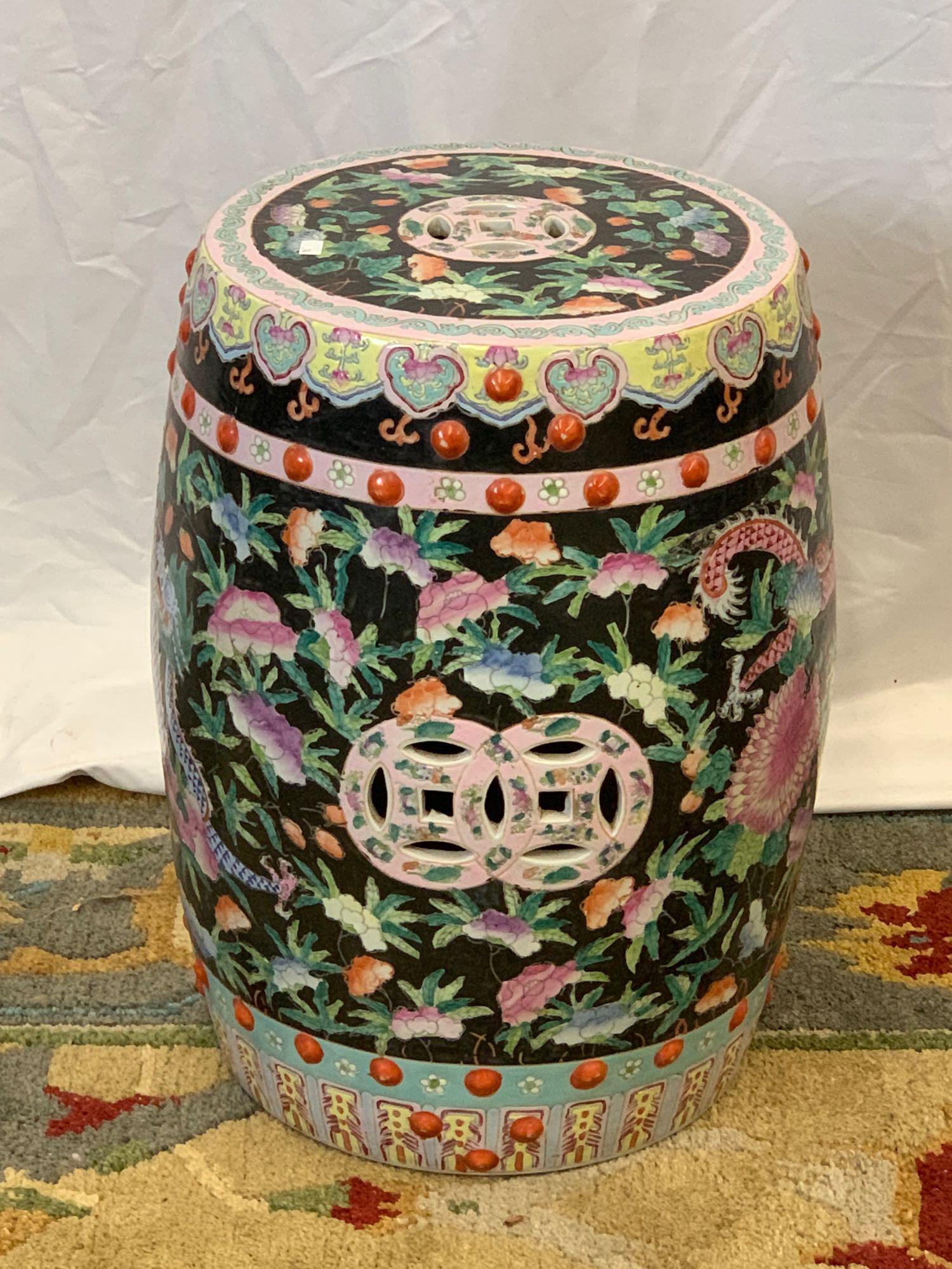 Chinese Famille Noir Porcelain Garden Seat: A vintage Chinese famille noir garden seat with dragon and floral decoration. Seal mark on base. 19 in tall x approx. 13 in diameter.