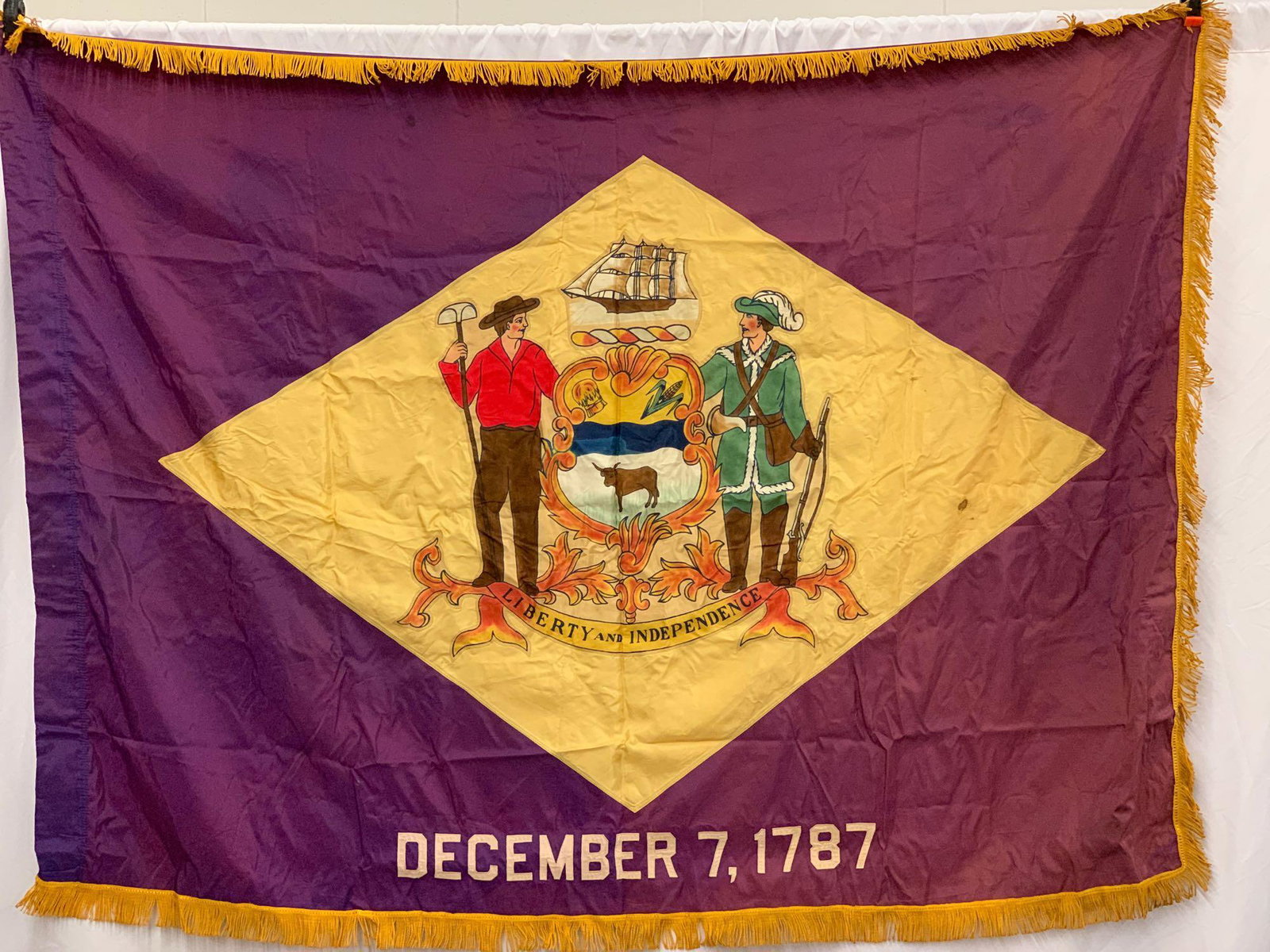 Vintage Flag of Delaware: A vintage flag of Delaware originally owned by former Governor of the state, Elbert Carvel. 68 in x 52 in.