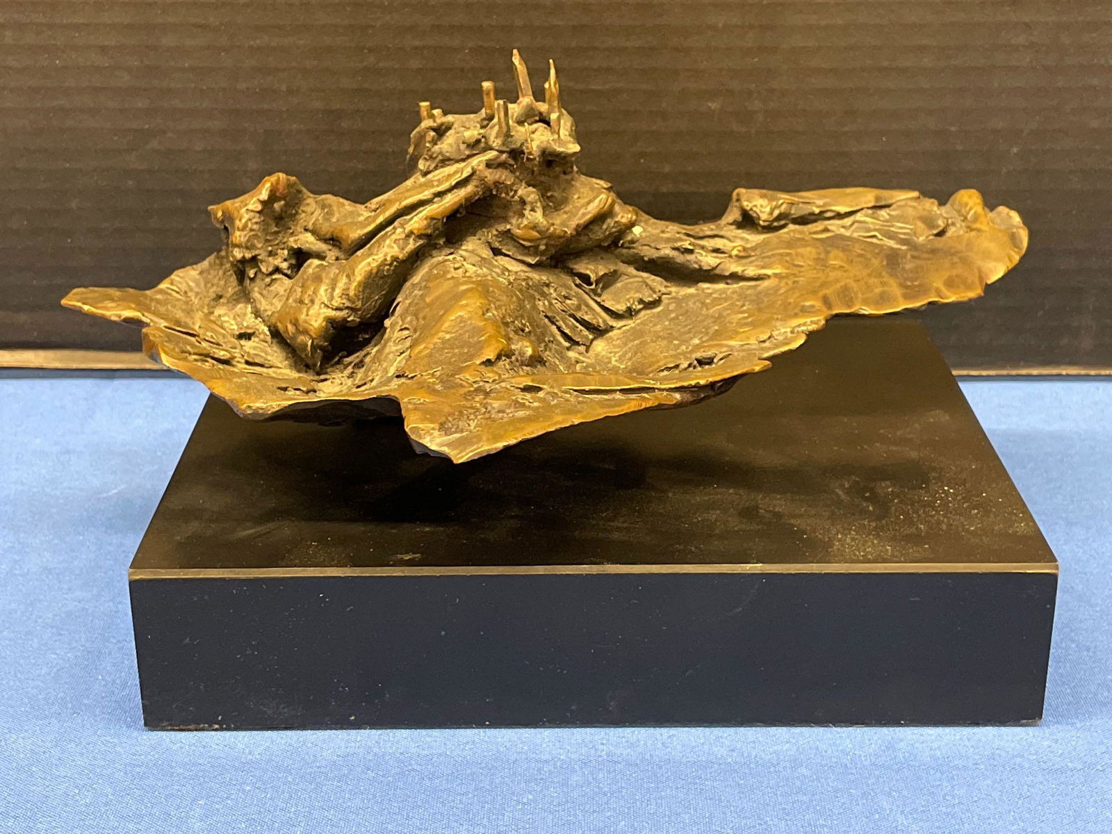 Judith Brown. Bronze Sculpture, Abstract: Judith Brown (American, 1932-1992). An abstract bronze sculpture titled "Castello". Appears unsigned. Mounted into a black laminated base with faint artist tag on underside. 5in tall x 9-1/2in wide x