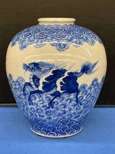 19th Century Japanese Blue & White Vase: A 19th Century Japanese vase with underglaze blue and white decoration. Signed on underside. 10in tall x approx. 8-1/2in diameter.