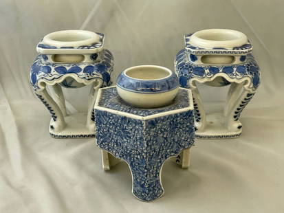 Three Japanese Sake Cup Stands: A grouping of three Japanese blue and white porcelain haidai or sake cup stands. Taller pair: 4-1/2in tall x 3-1/2in wide.