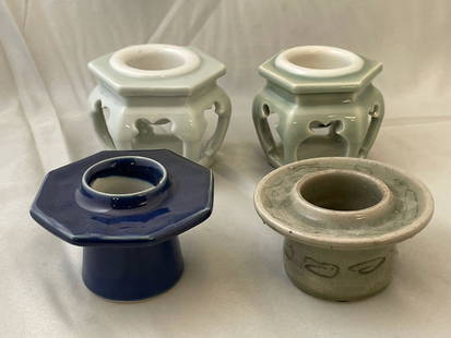 Four Japanese Sake Cup Stands: A grouping of four Japanese haidai or sake cup stands of varying forms. Taller pair: 2-1/2in tall x 3in wide.