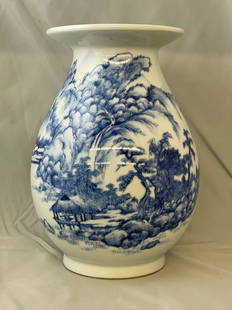 Blue & White Porcelain Vase: A blue and white porcelain vase with Shan Shui-style mountainous landscape design, with wooden box with calligraphy markings and red seal. Vase: 10in tall.