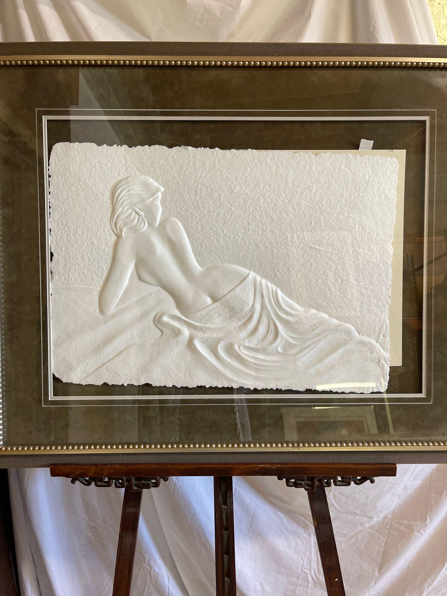 Roberta Peck. Paper Relief, Reclining Woman: Roberta Peck (American, 1947-). A framed relief of a nude woman lounging, titled "Reclining Woman". Signed in pencil in lower right. Image size: 20 x 27in.