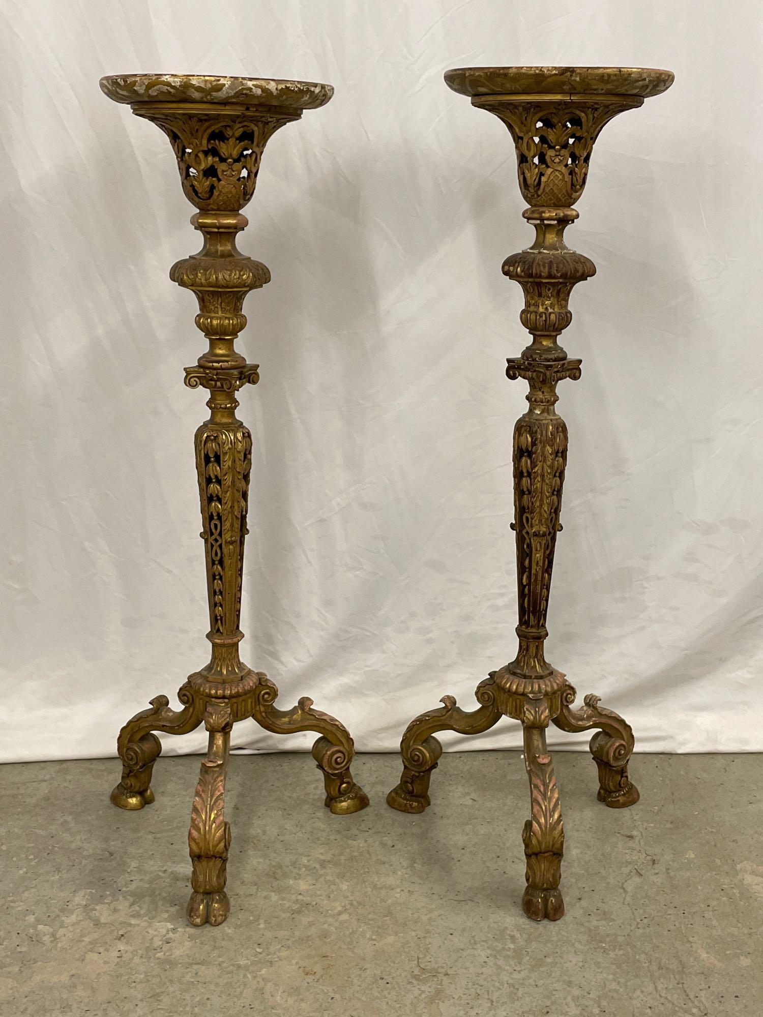 Fine Pair of Louis XV-style Giltwood Urn Stands: A fine pair of Louis XV-style giltwood fern stands having circular tops over carved shafts with pierced bellflower elements, each raised on three acanthus-carved cabriole legs with hoof feet. Each: 50