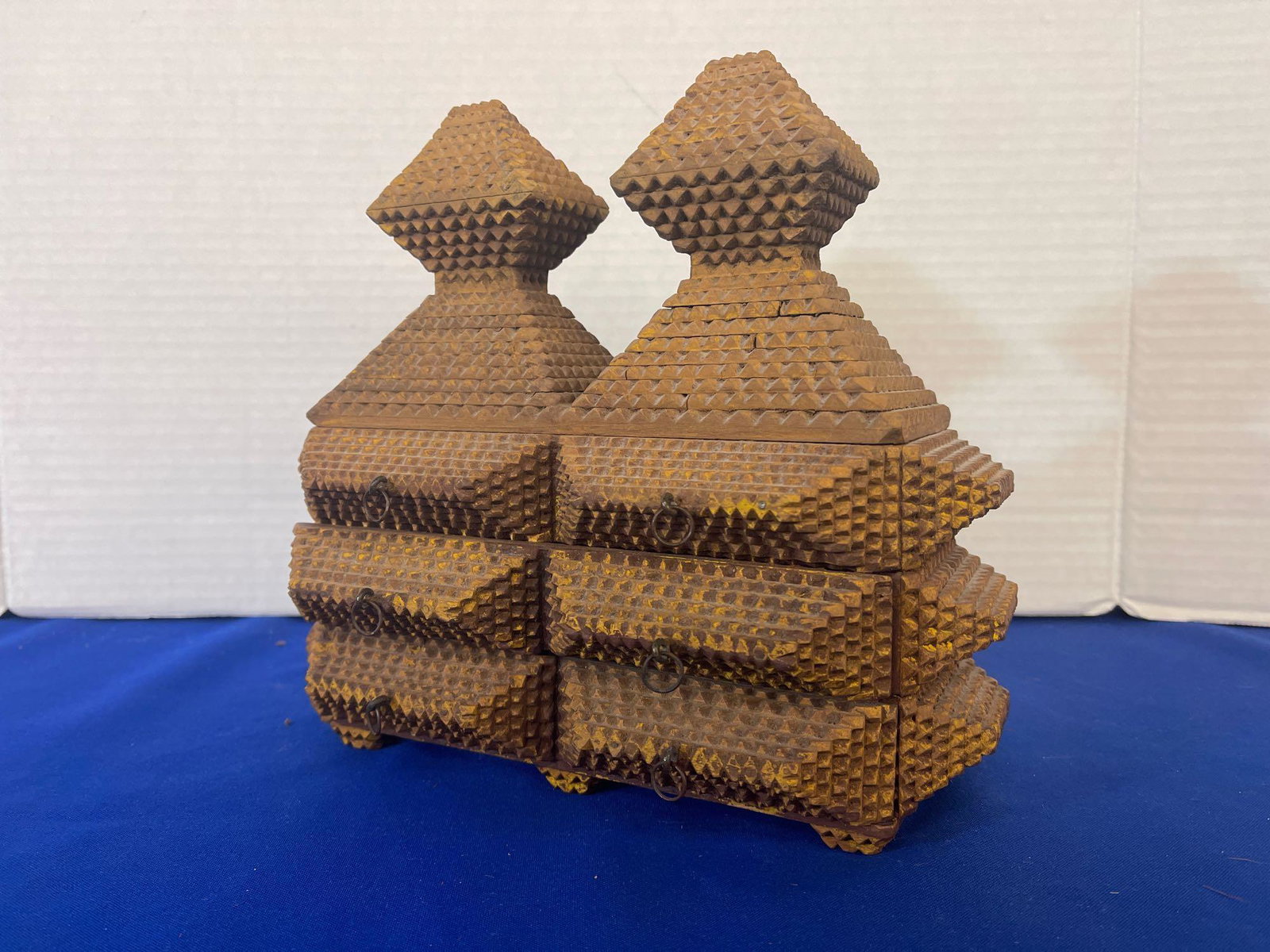 Tramp Art Vessel: A Tramp Art vessel having two drawers and a flip top lid. 10in tall x 11in wide x 6in deep.