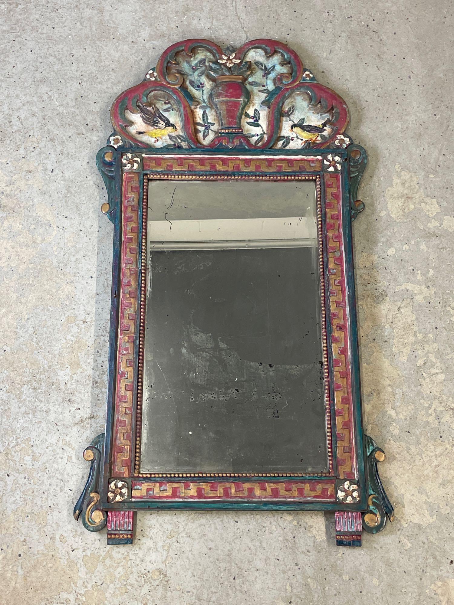 Antique Bird and Floral Painted Mirror: An antique mirror with bird and floral hand-painted design and silvered glass. 44in x 24in.