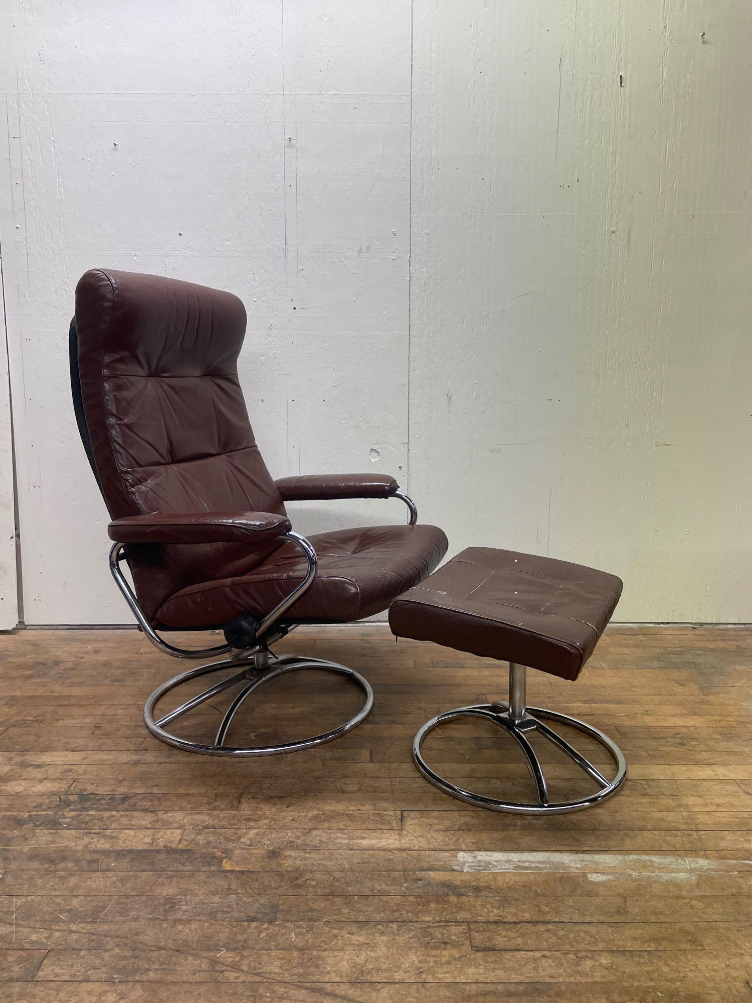 Ekornes Stressless Leather Recliner and Ottoman: (P2) Vintage leather recliner chair and ottoman by Ekornes of Norway. The chair has some light wear and a tear on the left arm but man is it comfy. The chrome base is in very good condition and the sw