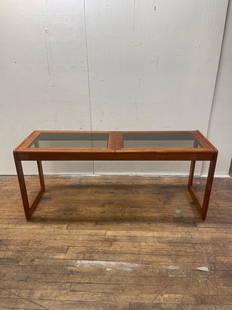 Komfort Danish Modern Teak Console Table: (A) Danish teakwood console table with smoke glass inserts by Komfort. Retains original comfort sticker. Teak frame is in excellent condition, glass has some light scratches but no chips. Measures 60"