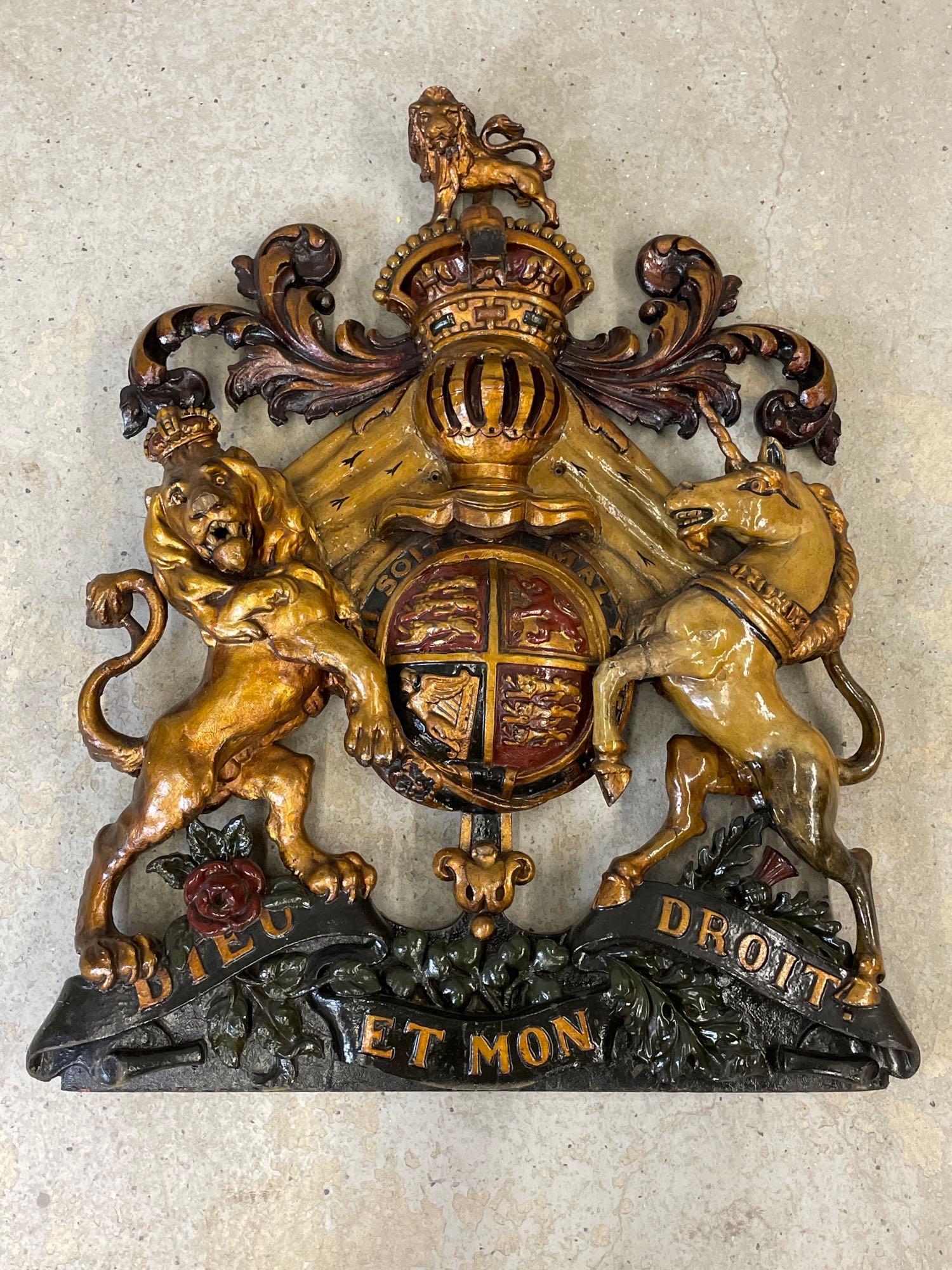 Antique Carved and Painted English Coat of Arms: An antique English carved and painted royal coat of arms depicting a lion and unicorn over "Dieu Et Mon Droit" ribbon. 37-1/2 in tall x 32 in wide.